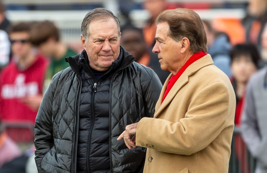 Alabama head coach Nick Saban talks with New England Patriots head coach Bill Belichick