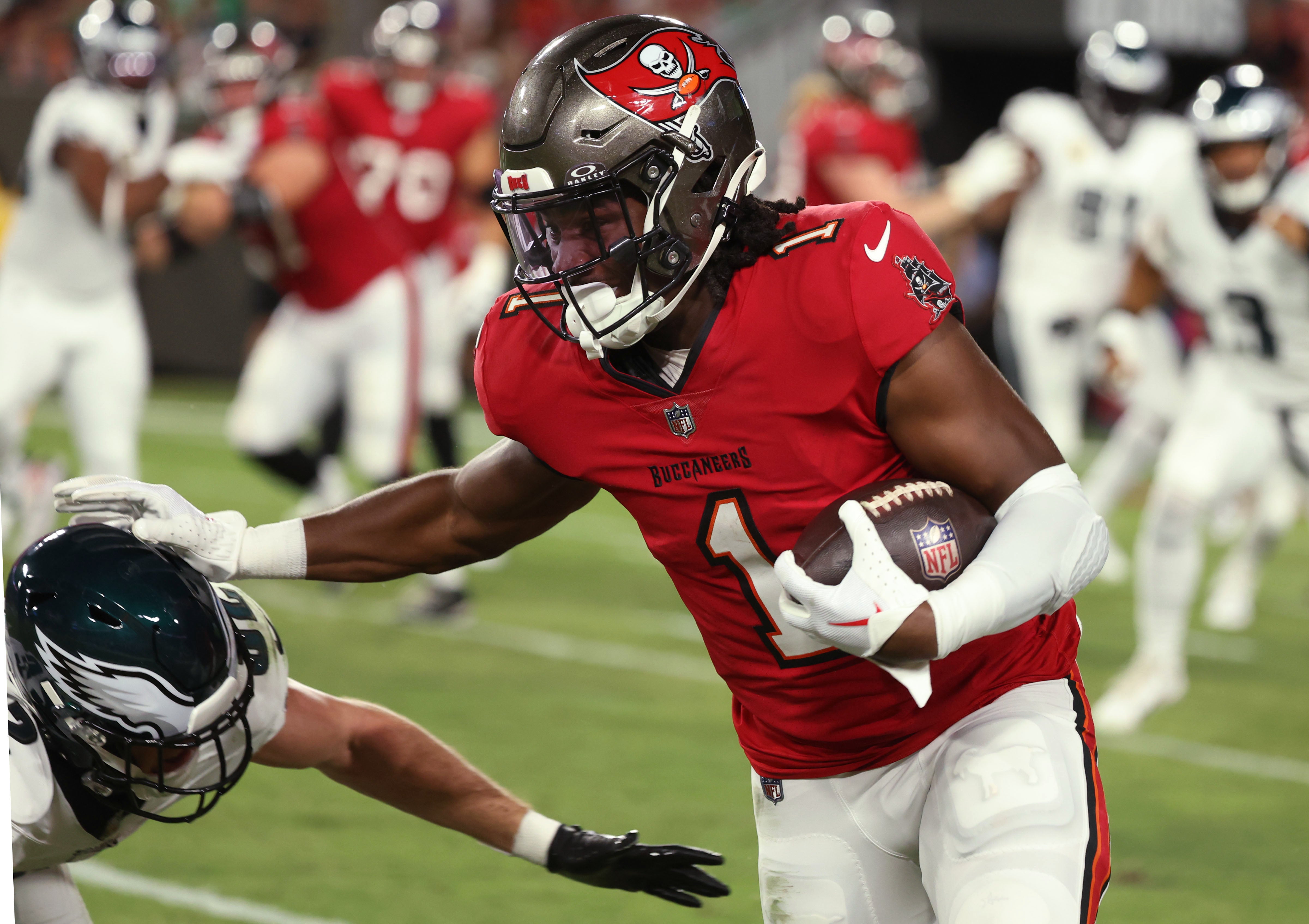 Sep 25, 2023; Tampa, Florida, USA; Tampa Bay Buccaneers running back Rachaad White (1) stiff arms Philadelphia Eagles safety Reed Blankenship (32) during the first half at Raymond James Stadium. Mandatory Credit: Kim Klement Neitzel-USA TODAY Sports