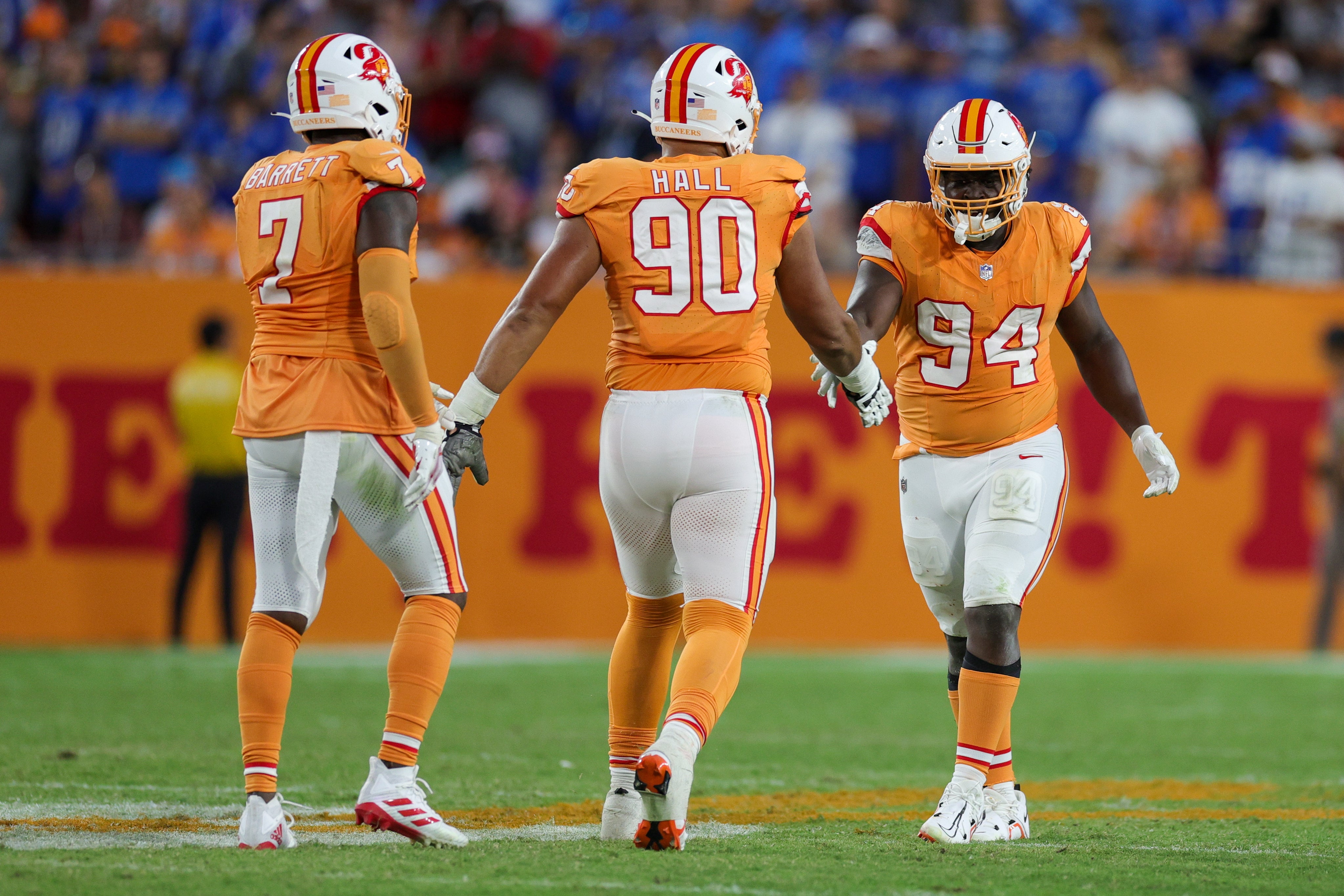 Oct 15, 2023; Tampa, Florida, USA; Tampa Bay Buccaneers defensive end Logan Hall (90) congratulated defensive tackle Calijah Kancey (94) after a sack against the Detroit Lions in the fourth quarter at Raymond James Stadium. Mandatory Credit: Nathan Ray Seebeck-USA TODAY Sports