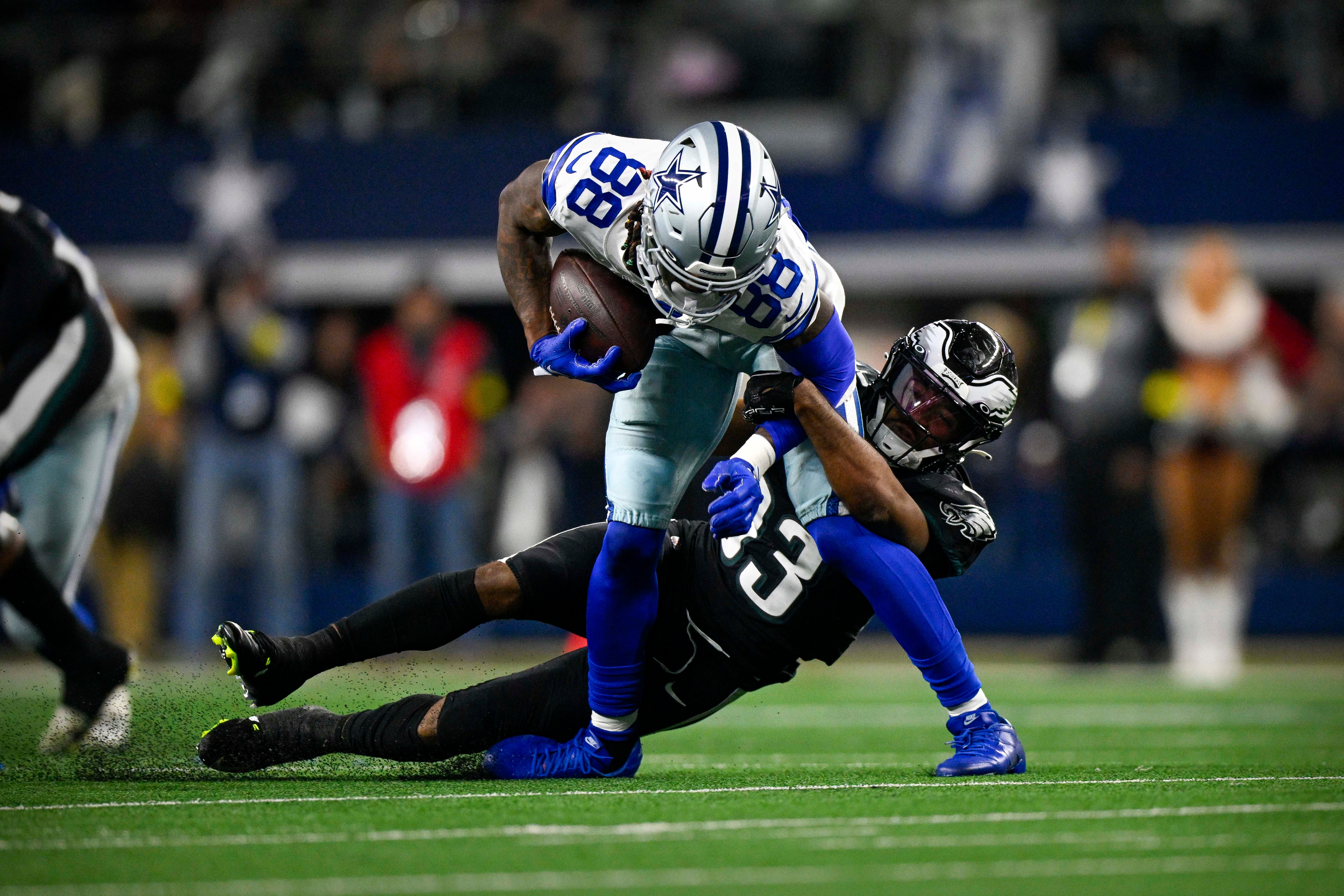 Dallas Cowboys wide receiver CeeDee Lamb (88) and Philadelphia Eagles cornerback Josiah Scott (33) in action during the game between the Dallas Cowboys and the Philadelphia Eagles at AT&T Stadium.