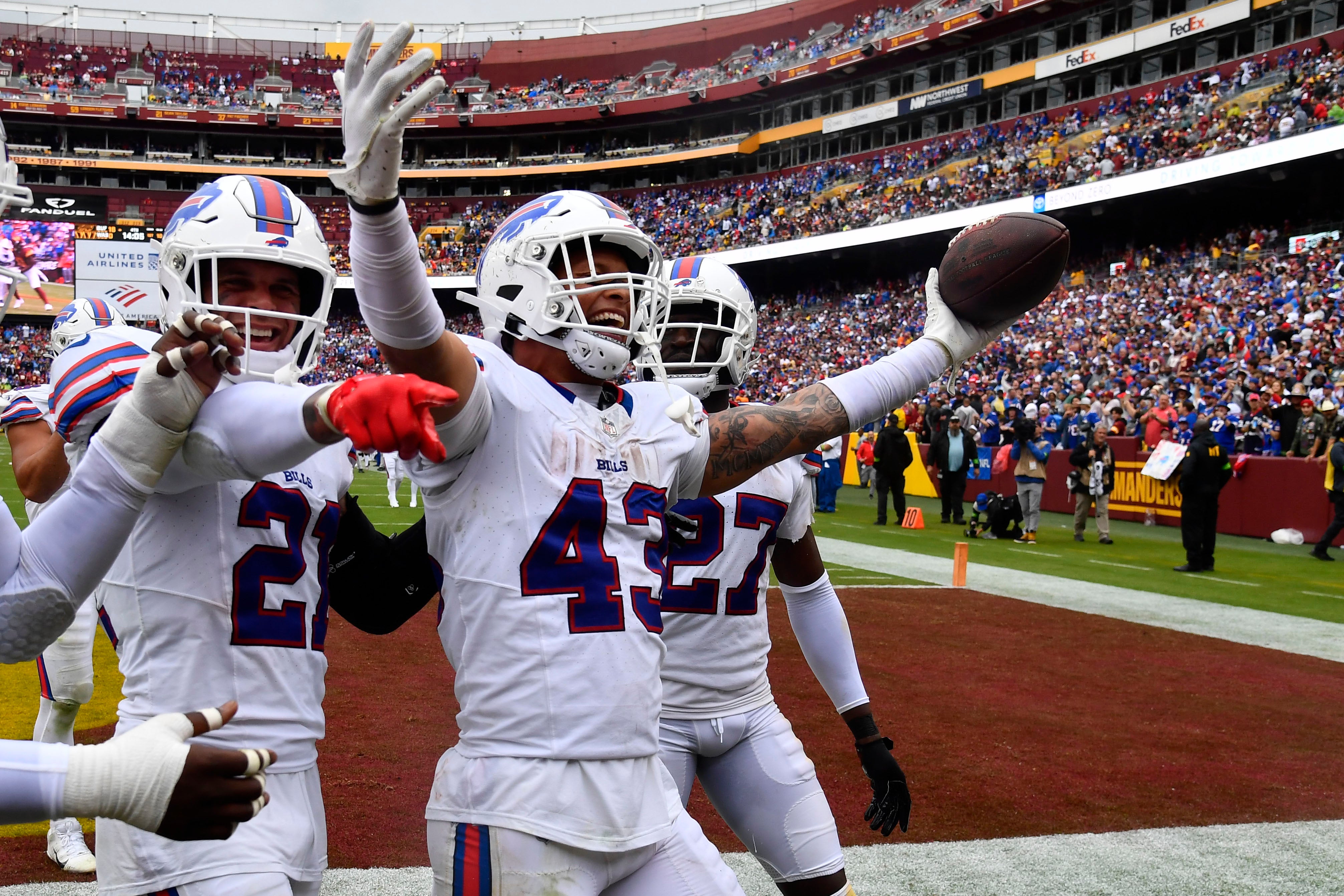 Buffalo Bills linebacker Terrel Bernard (43) celebrates with teammates after recovering a fumble against the Washington Commanders during the second half at FedExField. Mandatory Credit: Brad Mills-USA TODAY Sports