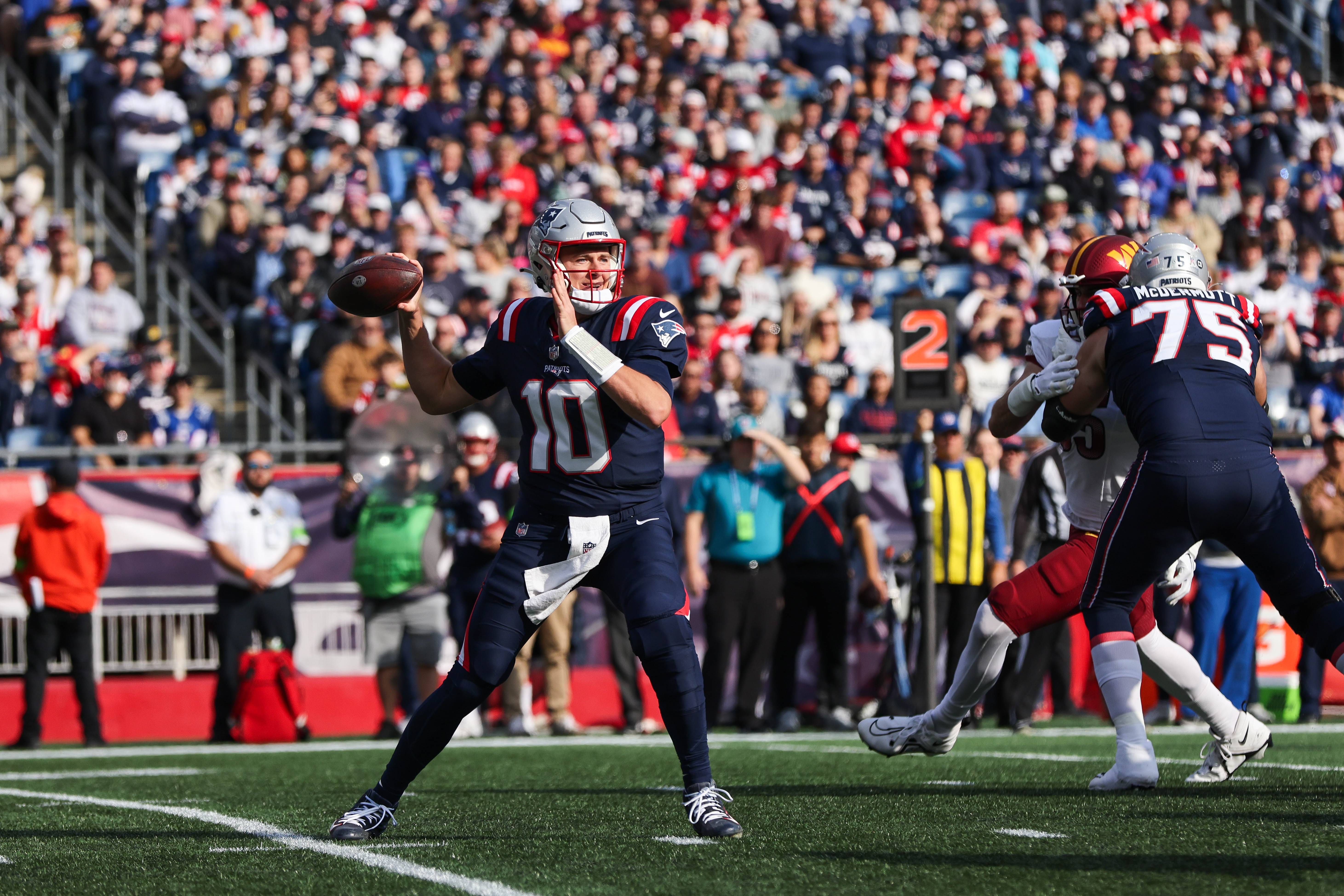 New England Patriots quarterback Mac Jones passes the ball during the first half against the Washington Commanders at Gillette Stadium