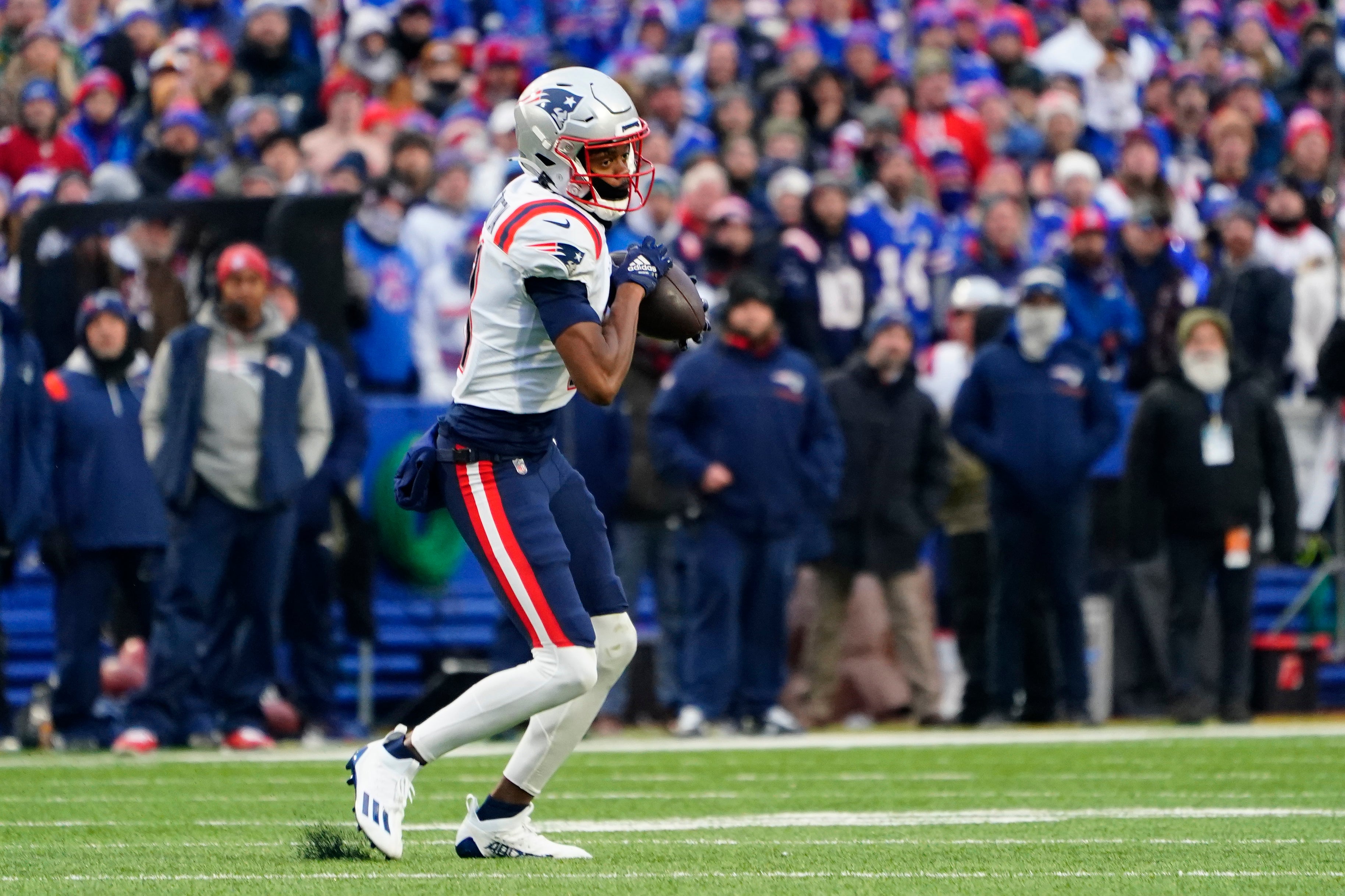 Jan 8, 2023; Orchard Park, New York, USA; New England Patriots wide receiver Tyquan Thornton (11) makes a catch against the Buffalo Bills during the second half at Highmark Stadium.