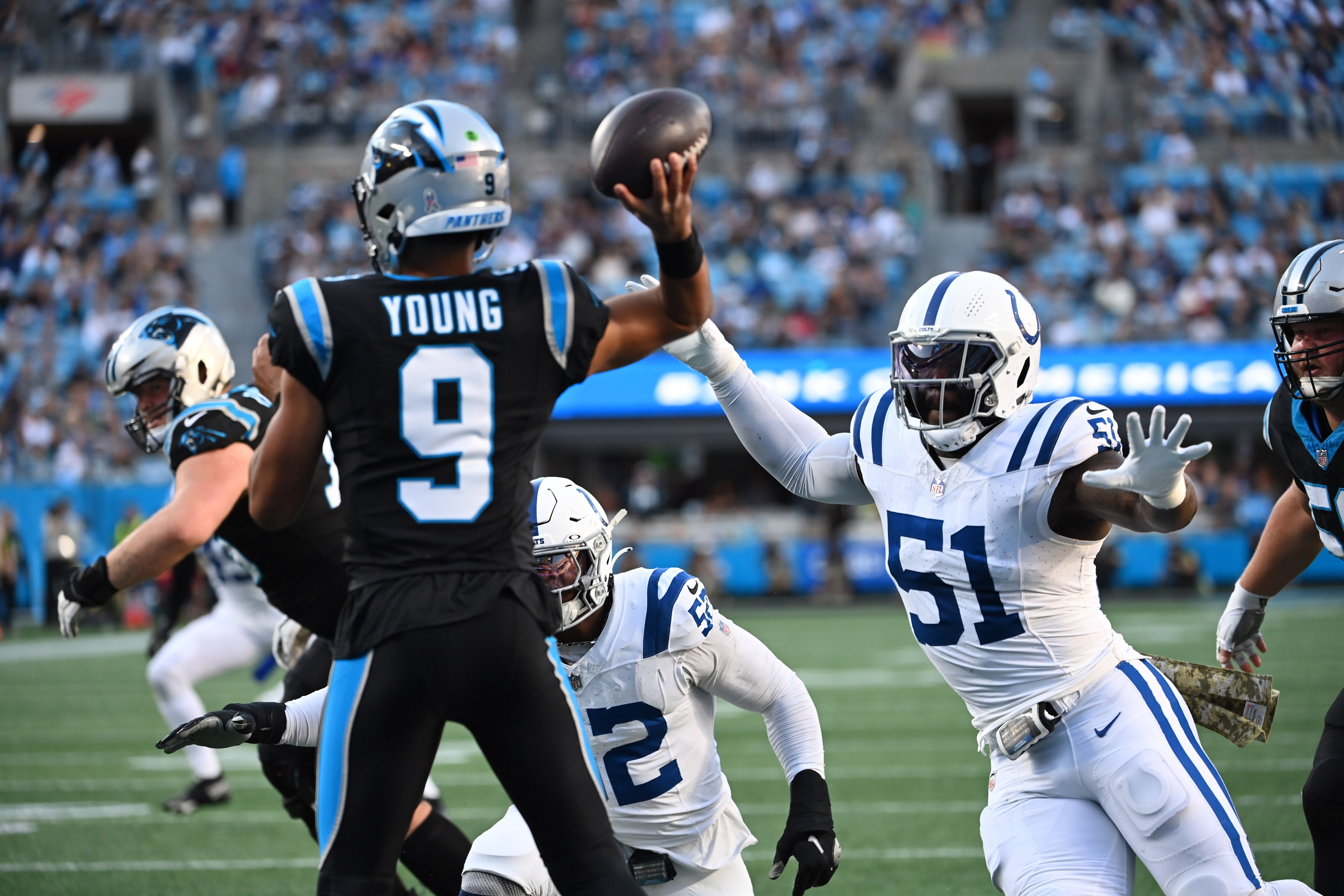 Nov 5, 2023; Charlotte, North Carolina, USA; Carolina Panthers quarterback Bryce Young (9) looks to pass as Indianapolis Colts defensive end Kwity Paye (51) pressures in the first quarter at Bank of America Stadium. Mandatory Credit: Bob Donnan-USA TODAY Sports