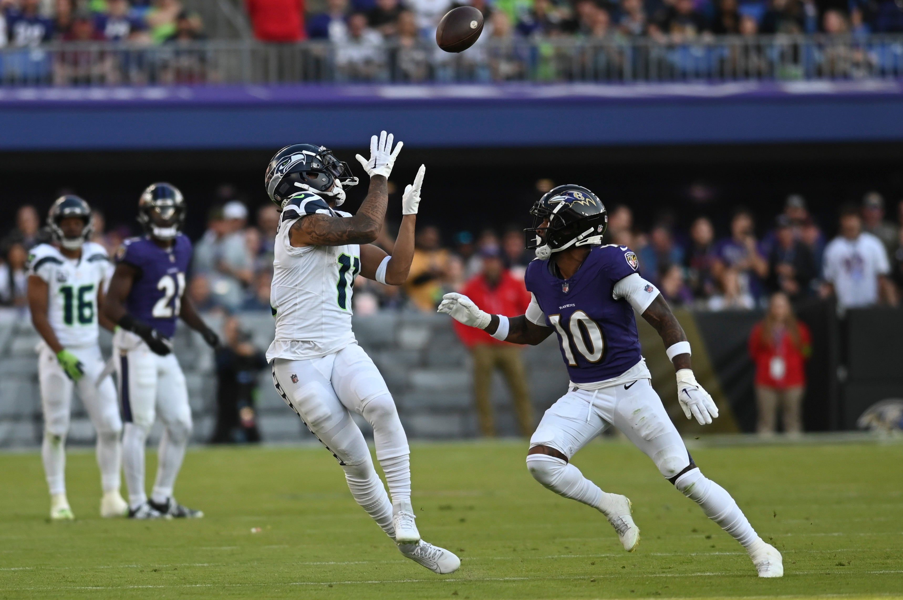 Nov 5, 2023; Baltimore, Maryland, USA; Seattle Seahawks wide receiver Jaxon Smith-Njigba (11) catches a pass as Baltimore Ravens cornerback Arthur Maulet (10) defends during the second half at M&T Bank Stadium. Mandatory Credit: Tommy Gilligan-USA TODAY Sports