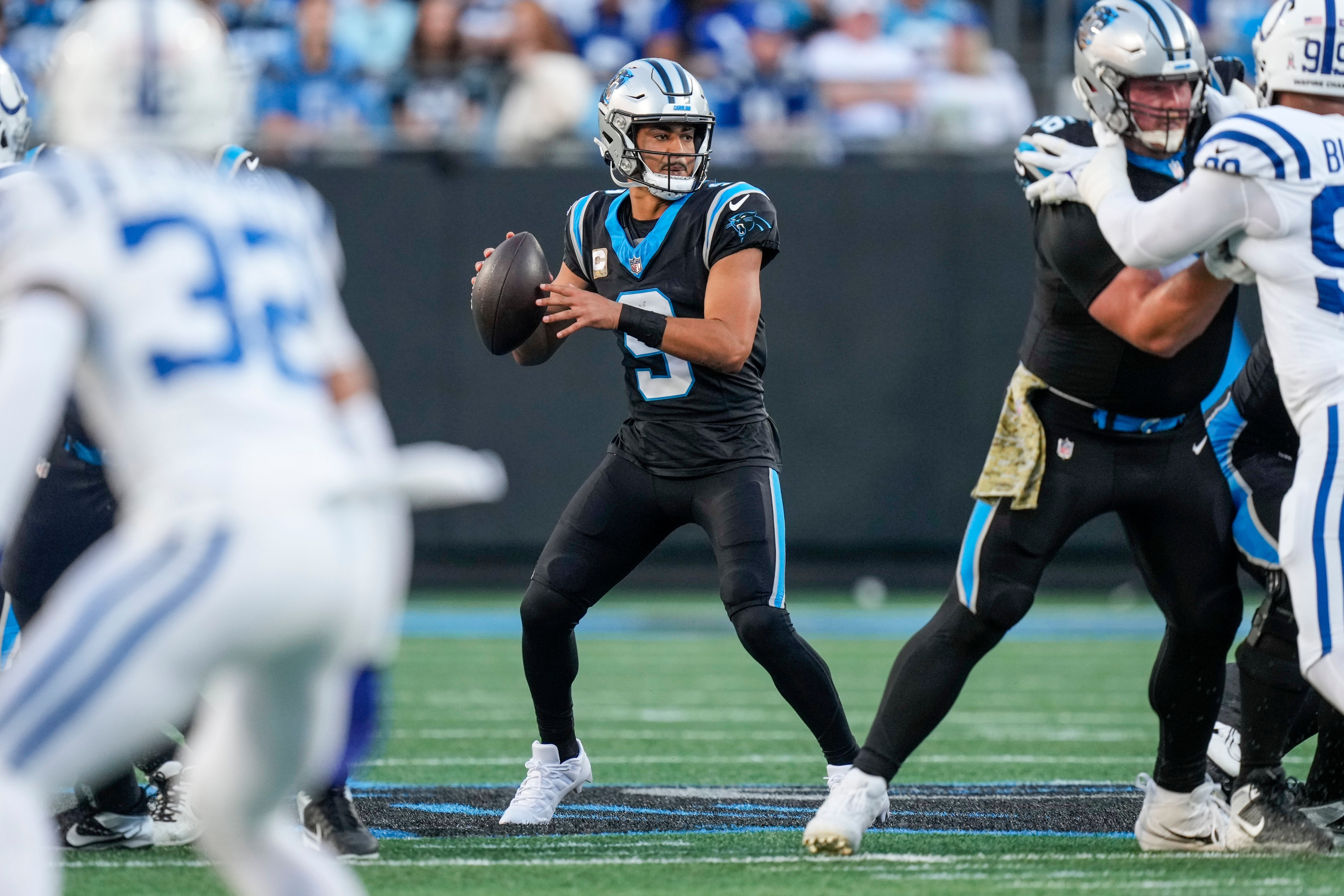 Nov 5, 2023; Charlotte, North Carolina, USA; Carolina Panthers quarterback Bryce Young (9) looks for a receiver during the first quarter against the Indianapolis Colts at Bank of America Stadium. Mandatory Credit: Jim Dedmon-USA TODAY Sports