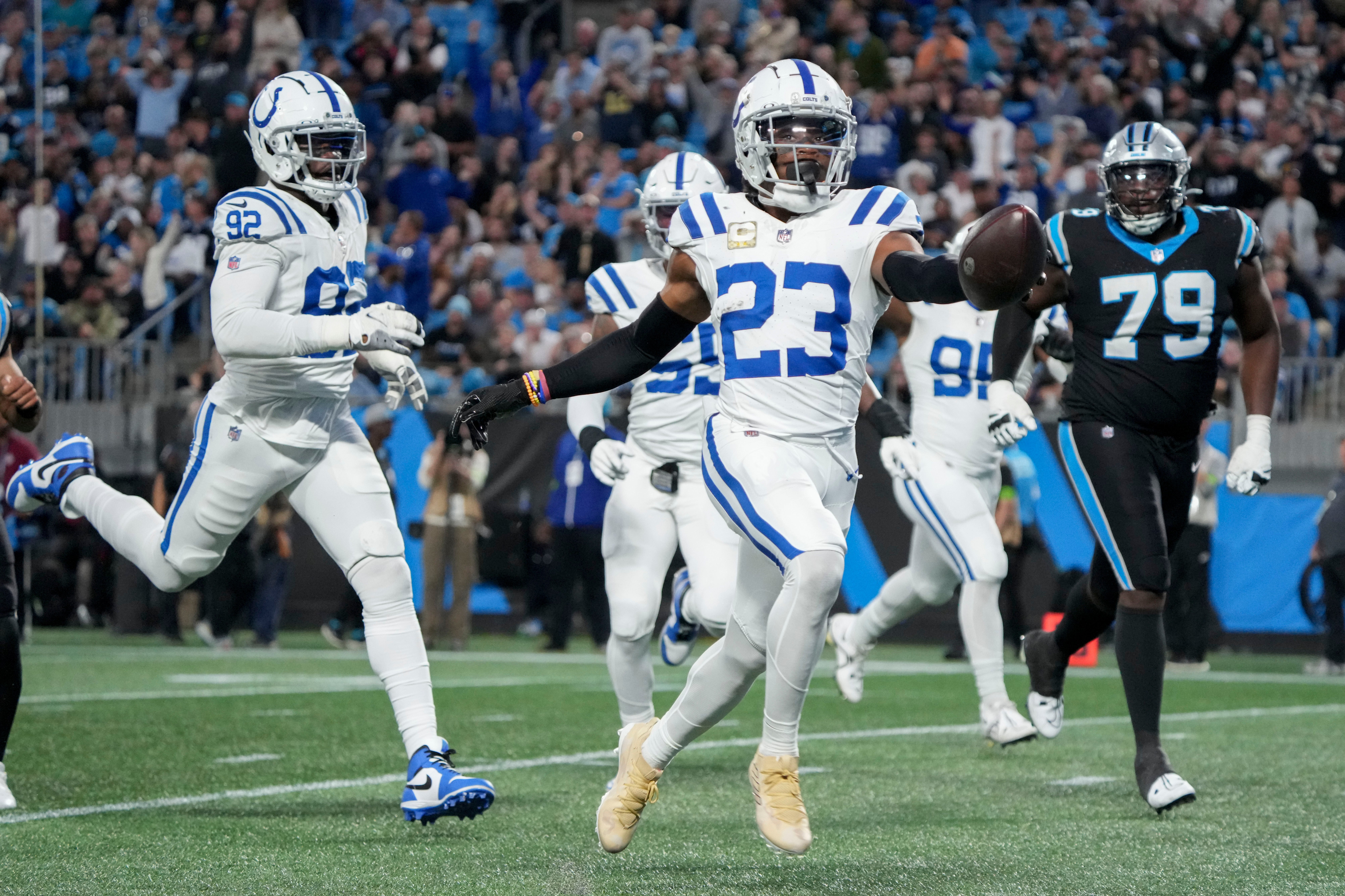 Nov 5, 2023, Charlotte, North Carolina, USA;Indianapolis Colts cornerback Kenny Moore II (23) runs 49 yards for a touchdown after intercepting a pass by Carolina Panthers quarterback Bryce Young (9) at Bank of America Stadium in Charlotte.
