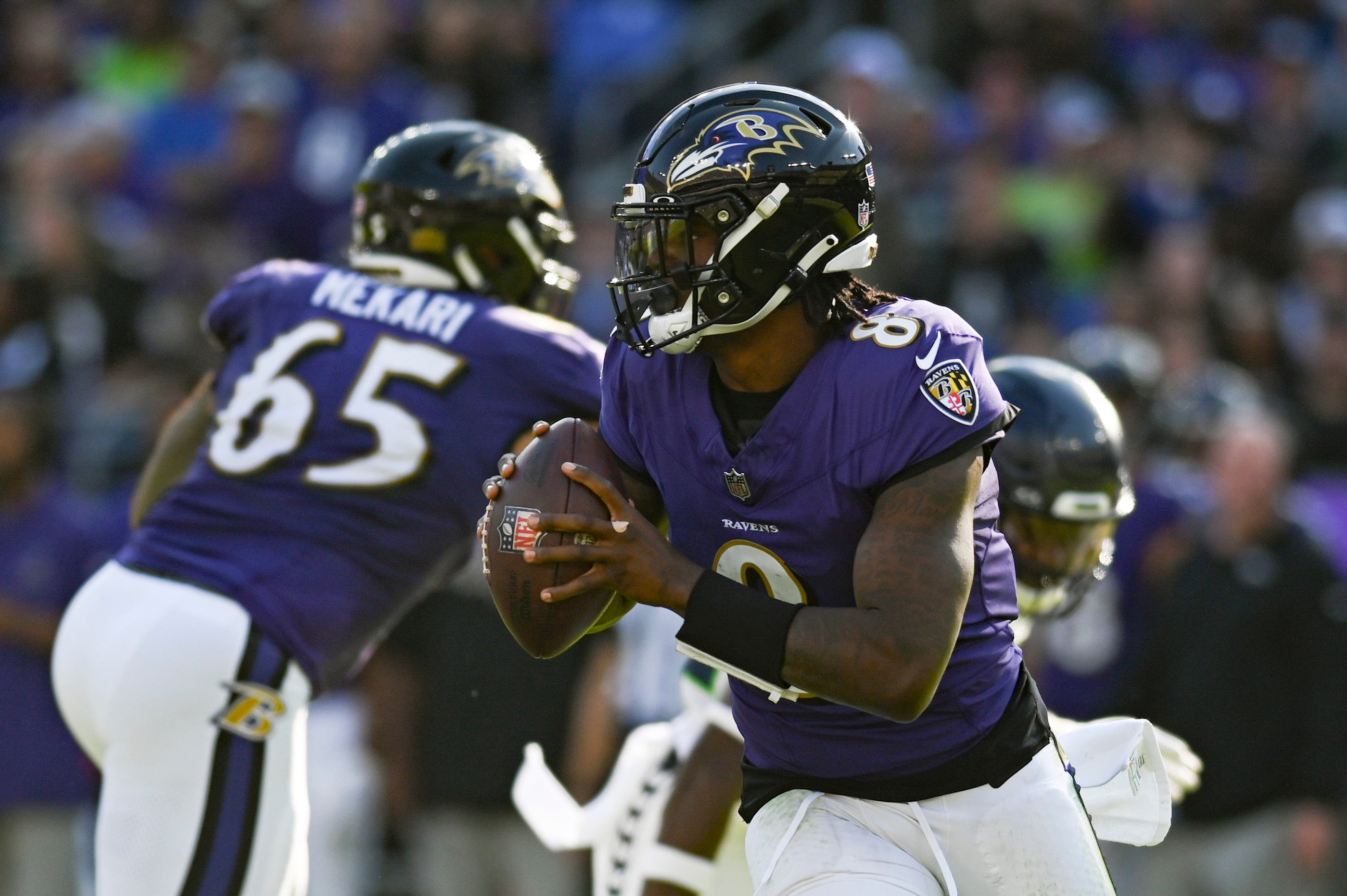 Baltimore Ravens quarterback Lamar Jackson (8) rolls out to pass during the first half against the Seattle Seahawks at M&T Bank Stadium. Mandatory Credit: Tommy Gilligan-USA TODAY Sports