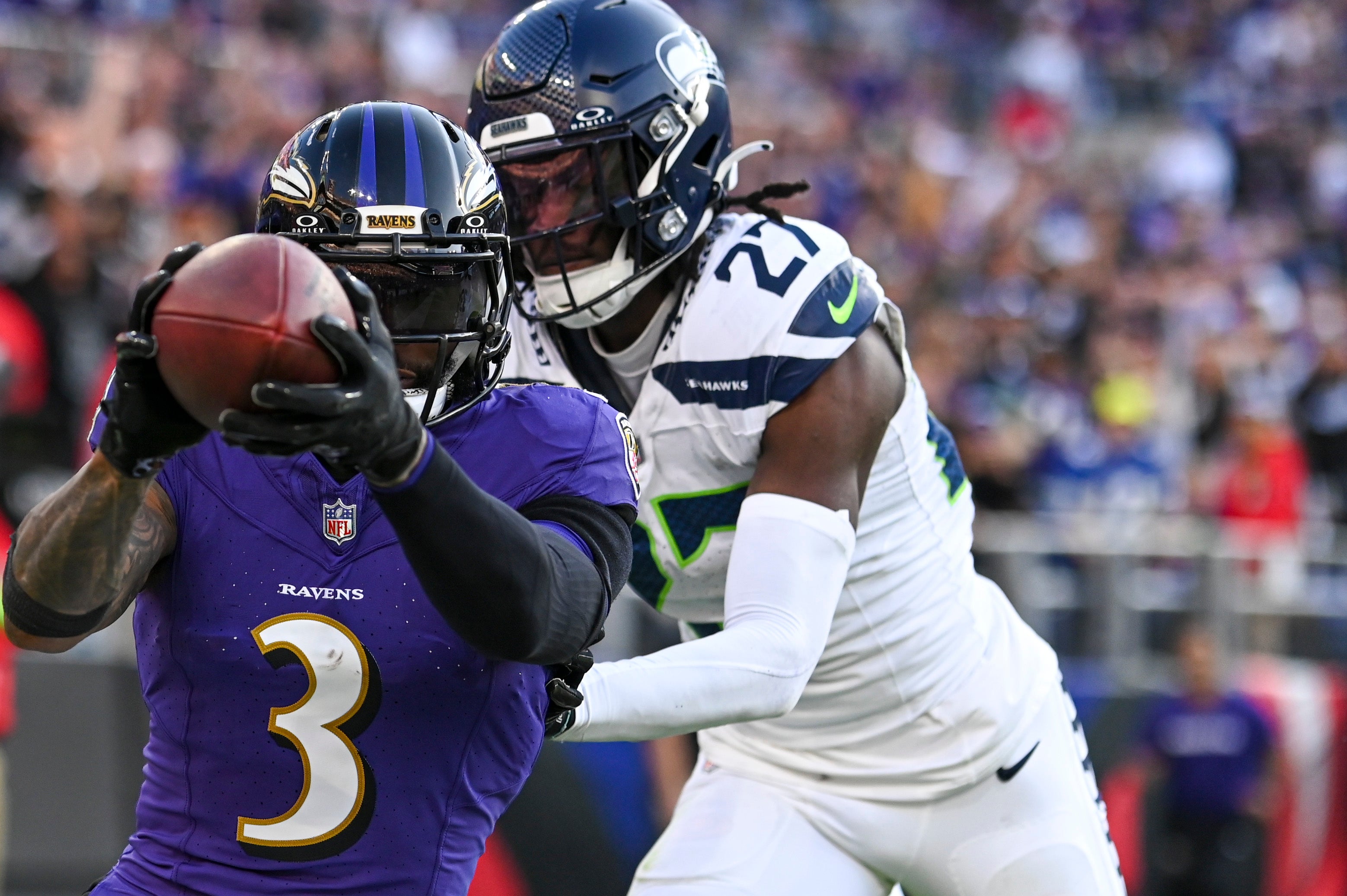 Baltimore Ravens wide receiver Odell Beckham Jr. (3) catches a pass for a touchdown in front of Seattle Seahawks cornerback Riq Woolen (27) during the fourth quarter at M&T Bank Stadium. Mandatory Credit: Tommy Gilligan-USA TODAY Sports