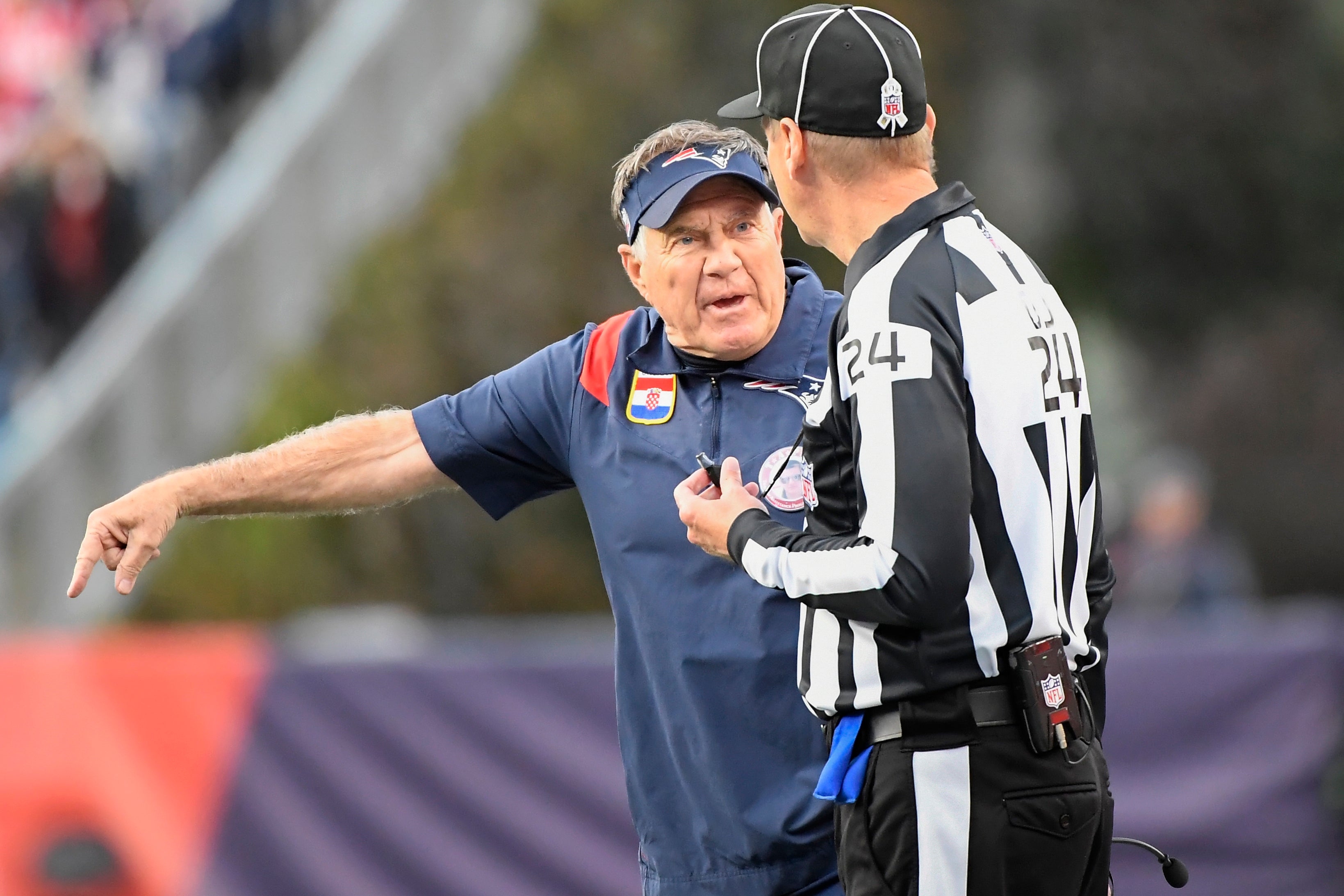 Patriots head coach Bill Belichick argues with down judge David Oliver during the second half against the Washington Commanders at Gillette Stadium
