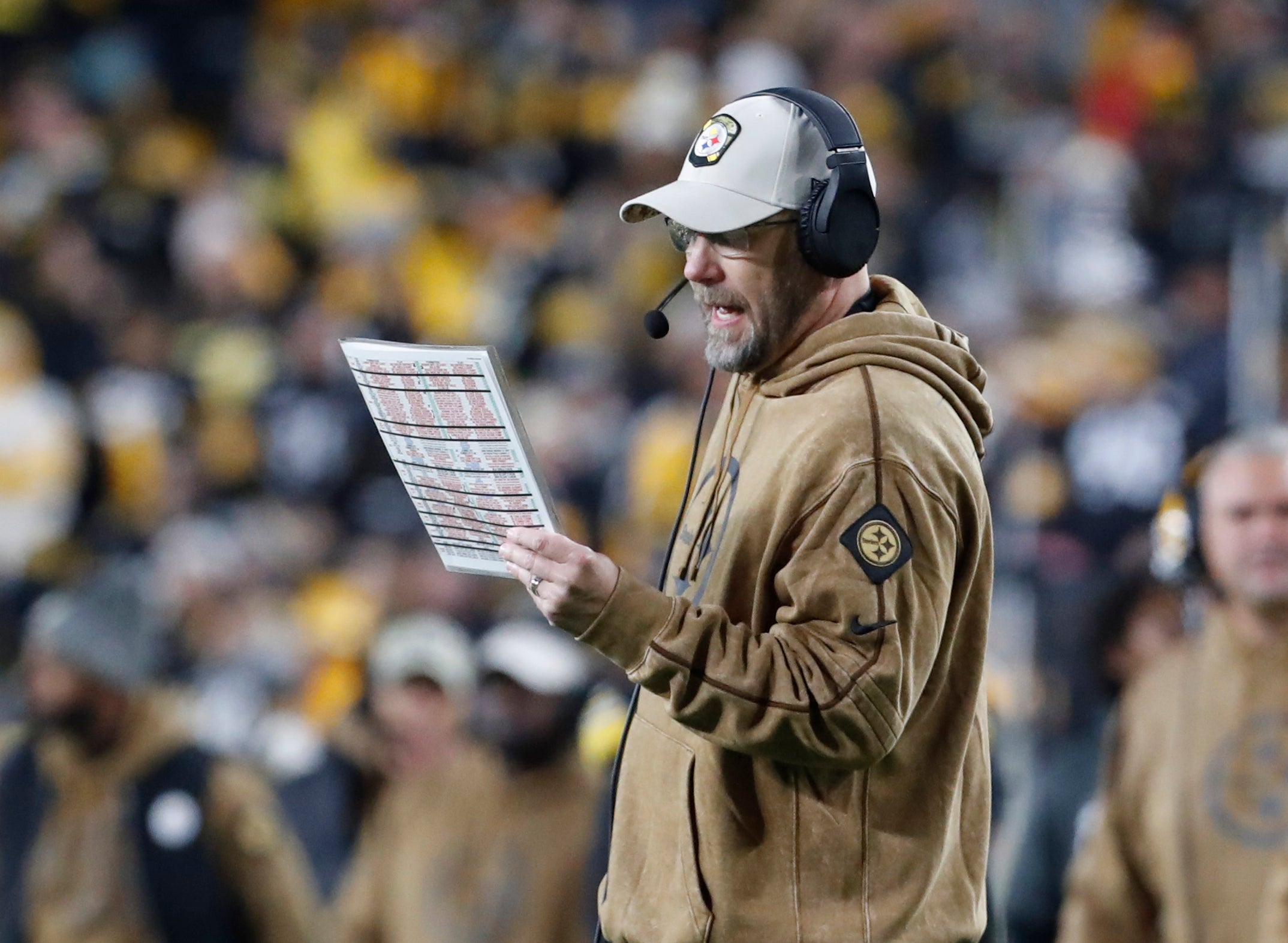 Nov 2, 2023; Pittsburgh, Pennsylvania, USA; Pittsburgh Steelers offensive coordinator Matt Canada calls a play on the sidelines against the Tennessee Titans during the second quarter at Acrisure Stadium. Mandatory Credit: Charles LeClaire-USA TODAY Sports