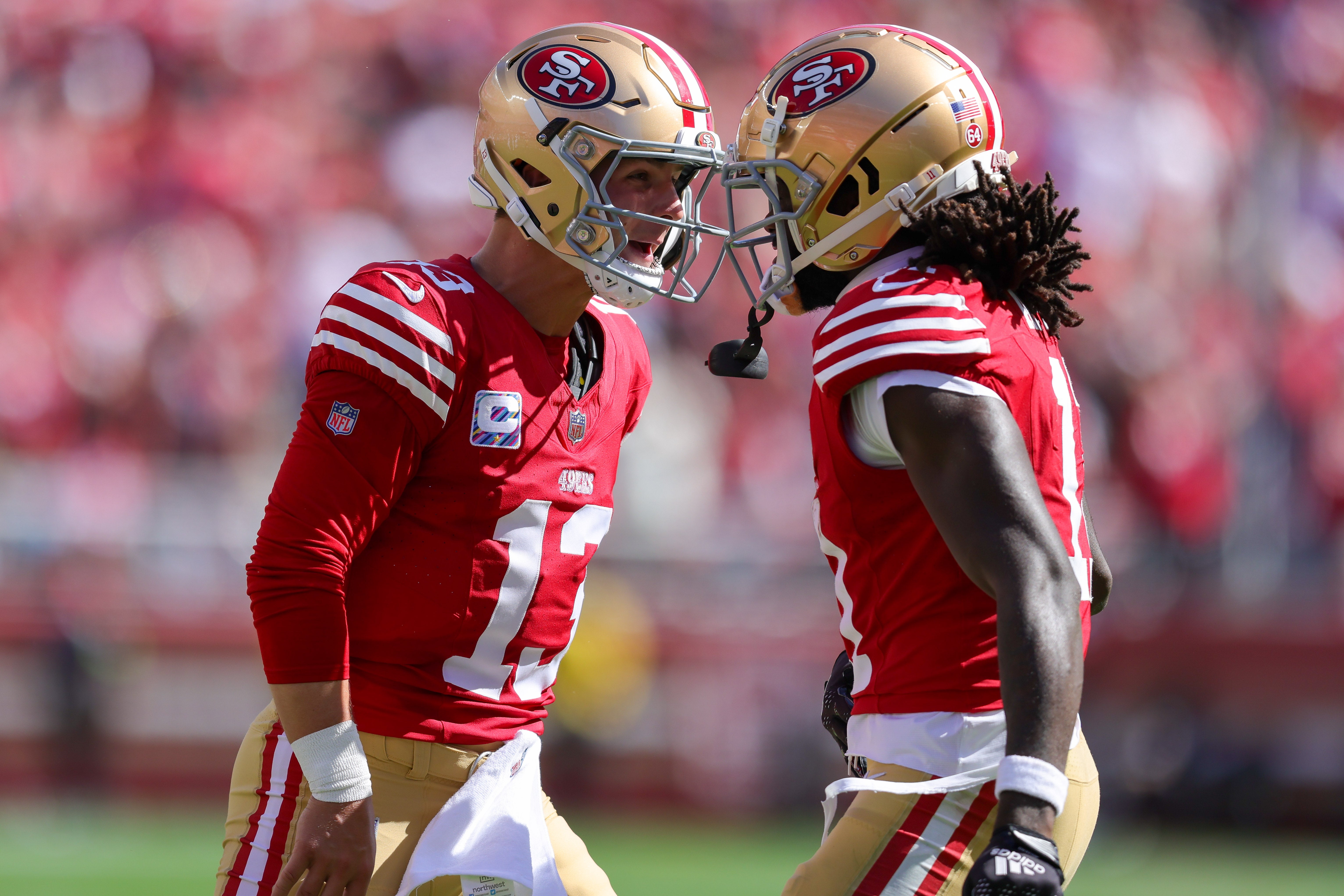Oct 1, 2023; Santa Clara, California, USA; San Francisco 49ers quarterback Brock Purdy (13) celebrates after a touchdown during the second quarter against the Arizona Cardinals at Levi's Stadium.