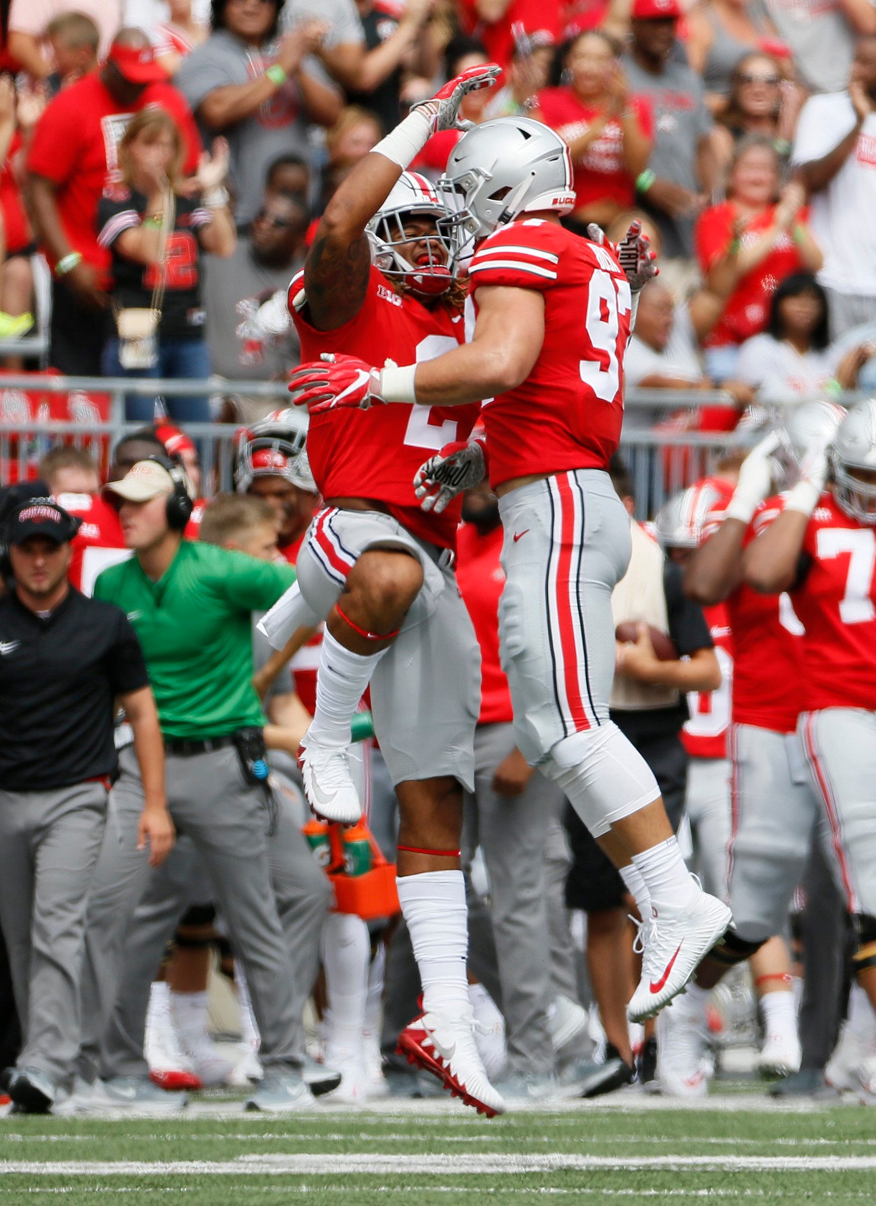 Ohio State Buckeyes defensive end Nick Bosa (97) is congratulated by defensive end Chase Young (2) after recovering a fumble behind Ohio State Buckeyes running back Brian Snead (6) during the first quarter of the NCAA football game at Ohio Stadium in Columbus on Sept. 1, 2018.