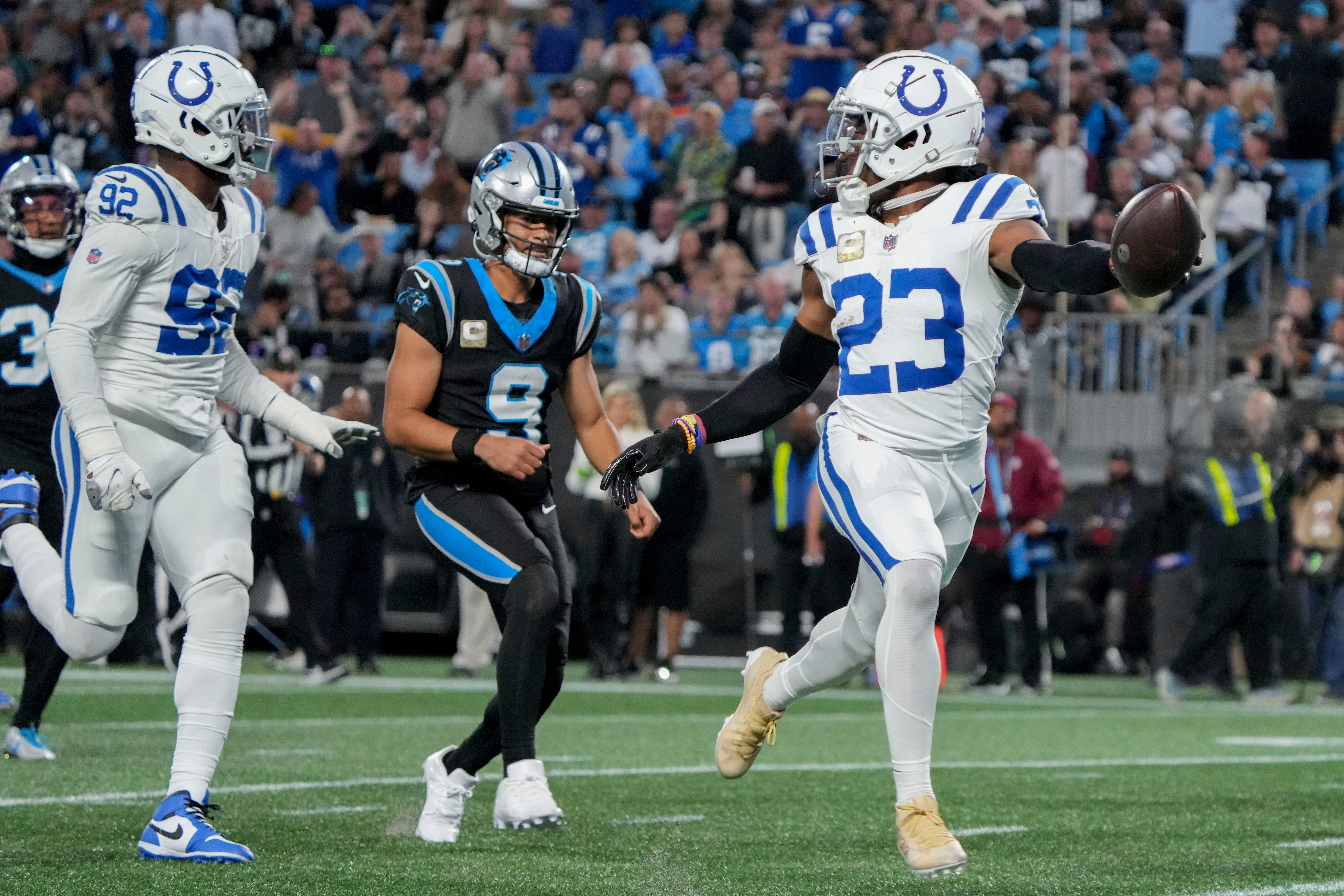 Nov 5, 2023, Charlotte, North Carolina, USA; Indianapolis Colts cornerback Kenny Moore II (23) runs 49 yards for a touchdown after intercepting a pass by Carolina Panthers quarterback Bryce Young (9) at Bank of America Stadium in Charlotte.