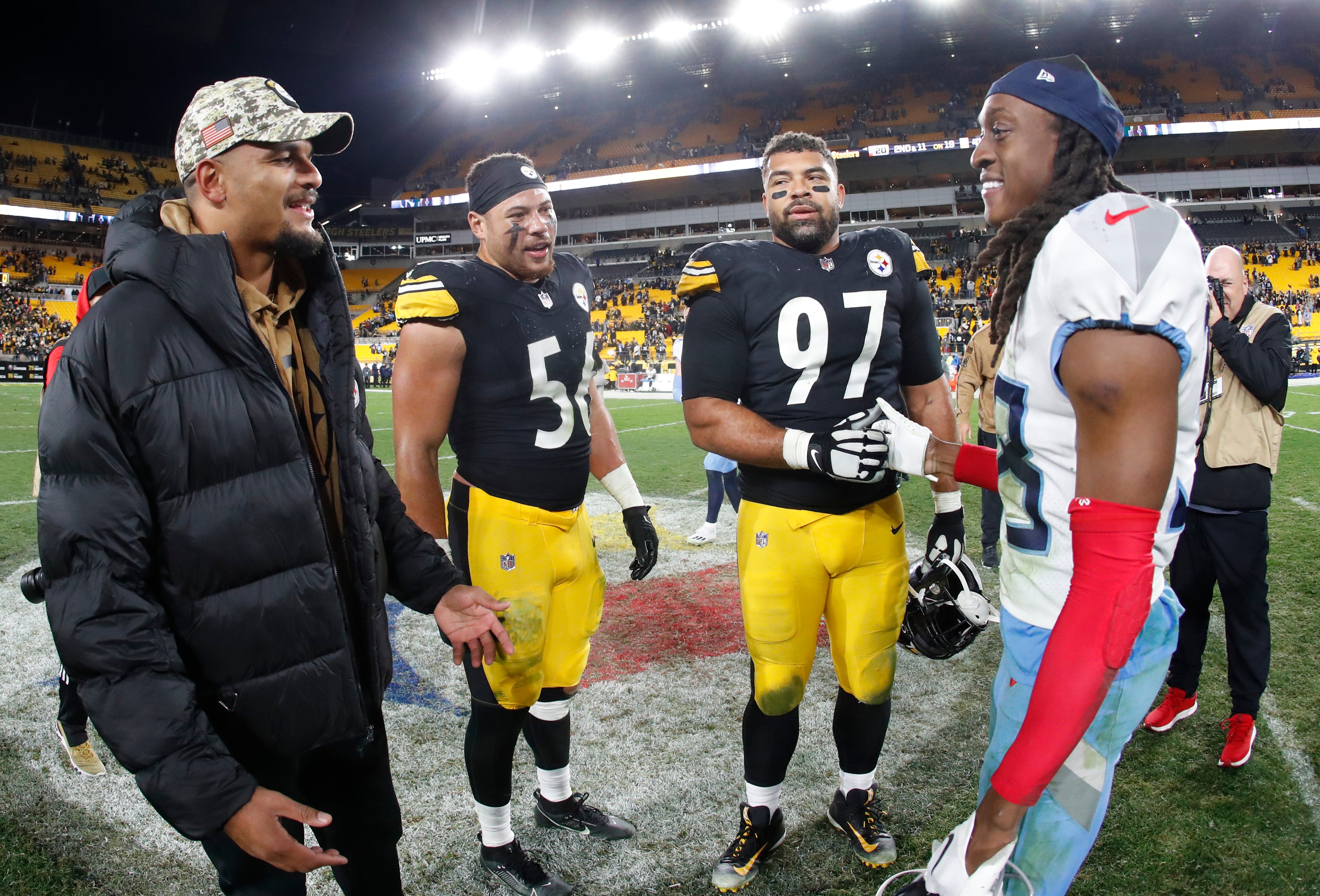 Nov 2, 2023; Pittsburgh, Pennsylvania, USA; Pittsburgh Steelers safety Minkah Fitzpatrick (left), linebacker Alex Highsmith (56), defensive tackle Cameron Heyward (97) meet with Tennessee Titans safety Terrell Edmunds (38) after the game at Acrisure Stadium. Pittsburgh won 20-16. Mandatory Credit: Charles LeClaire-USA TODAY Sports  