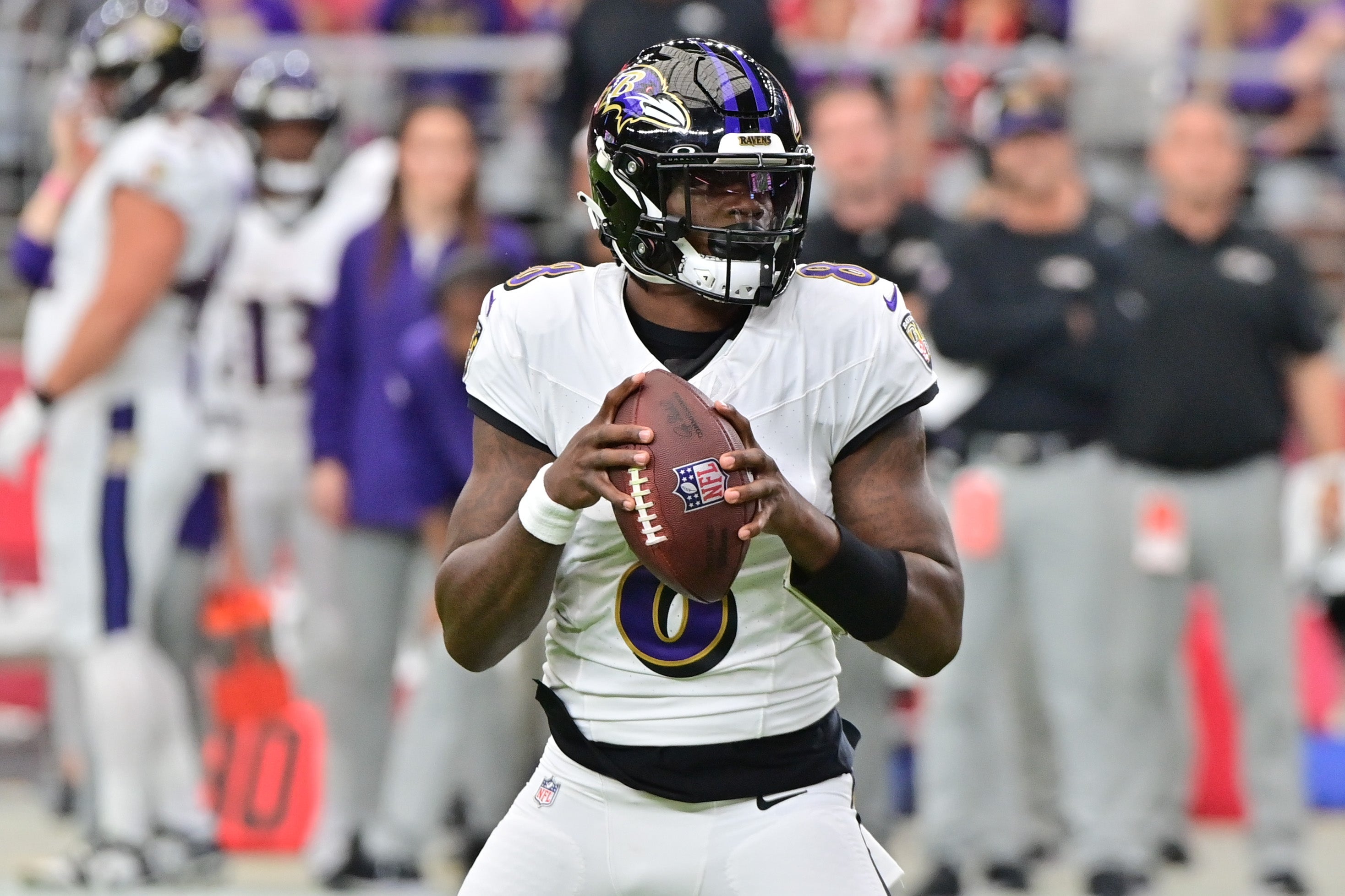 Baltimore Ravens quarterback Lamar Jackson (8) looks to pass in the first half against the Arizona Cardinals at State Farm Stadium.