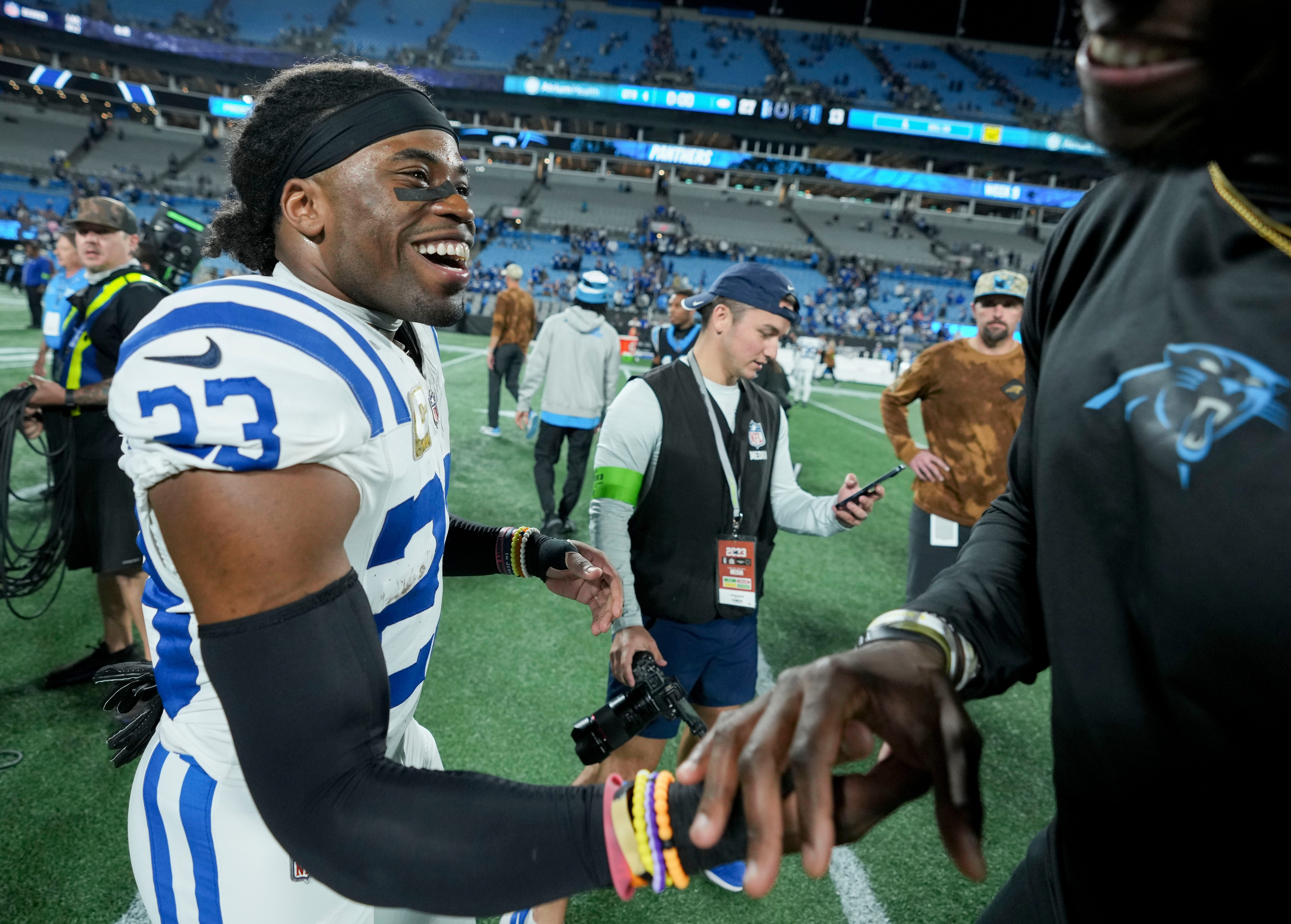 Indianapolis Colts cornerback Kenny Moore II (23) smiles as he meets a Carolina Panthers player on the field Sunday, Nov. 5, 2023, after a game against the Carolina Panthers at Bank of America Stadium in Charlotte.