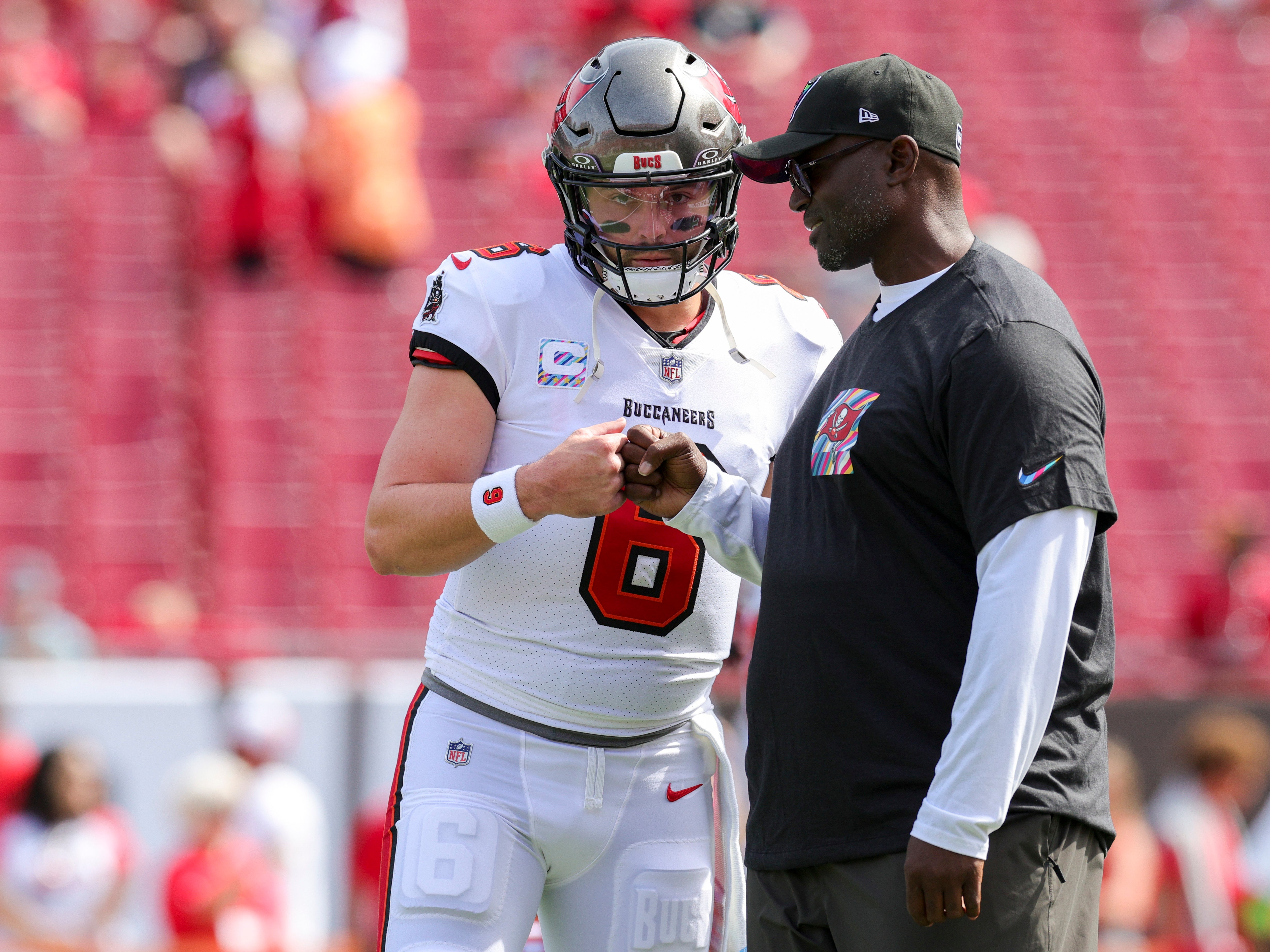 Oct 22, 2023; Tampa, Florida, USA; Tampa Bay Buccaneers quarterback Baker Mayfield (6) speaks to head coach Todd Bowles before a game against the Atlanta Falcons at Raymond James Stadium. Mandatory Credit: Nathan Ray Seebeck-USA TODAY Sports