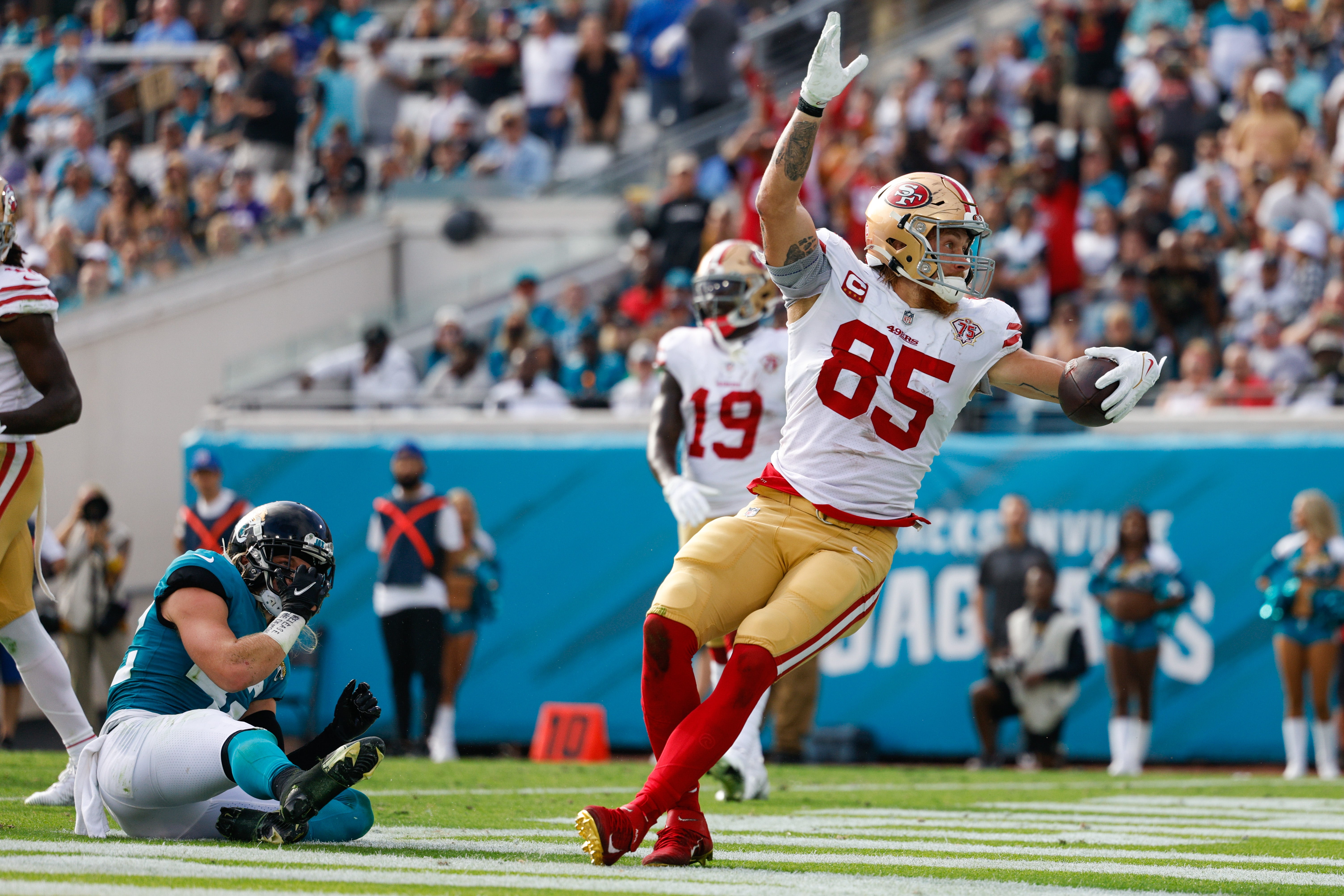 Nov 21, 2021; Jacksonville, Florida, USA; San Francisco 49ers tight end George Kittle (85) reacts after scoring a touchdown in the second half against the Jacksonville Jaguars at TIAA Bank Field.