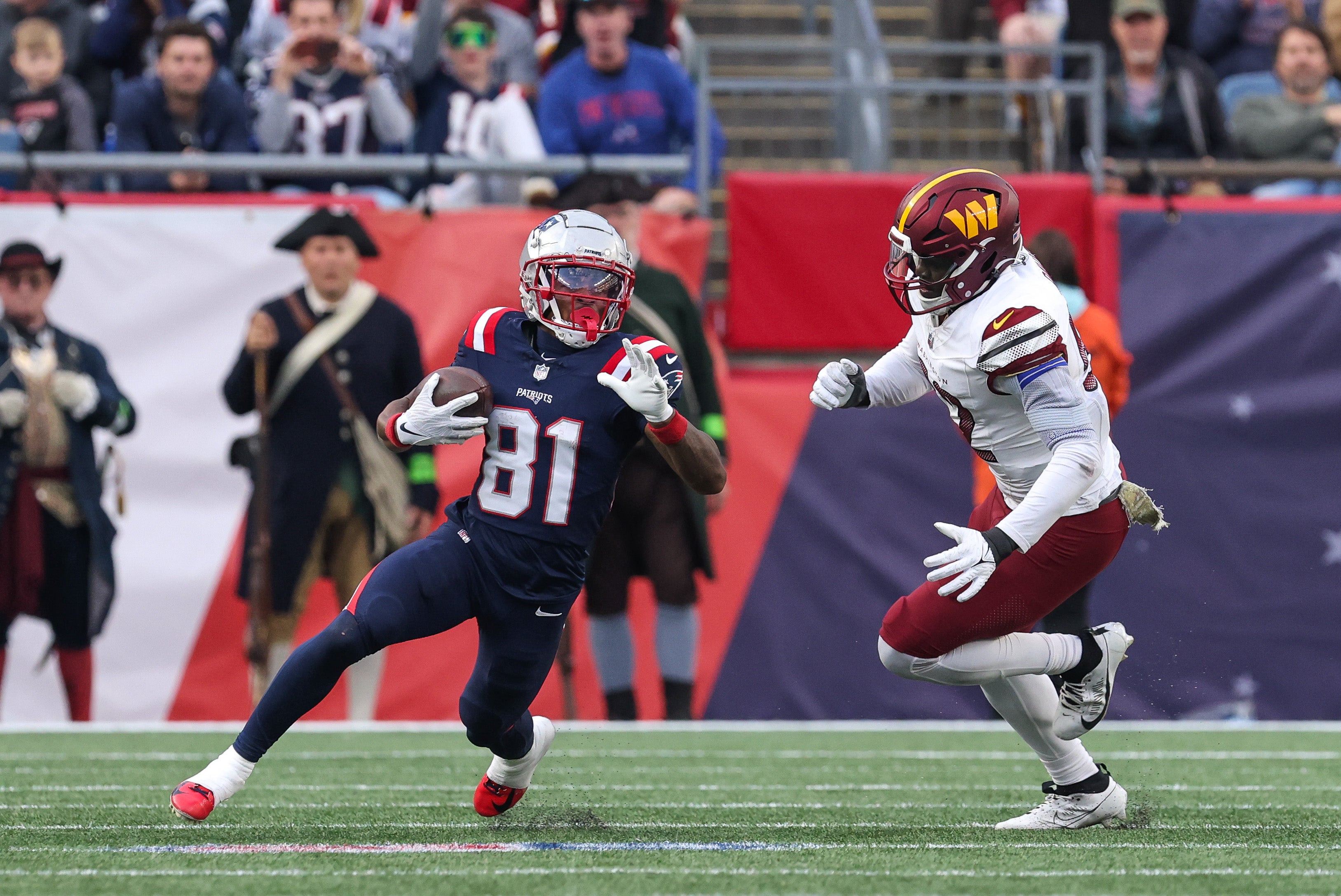 New England Patriots receiver Demario Douglas runs the ball during the second half against the Washington Commanders at Gillette Stadium