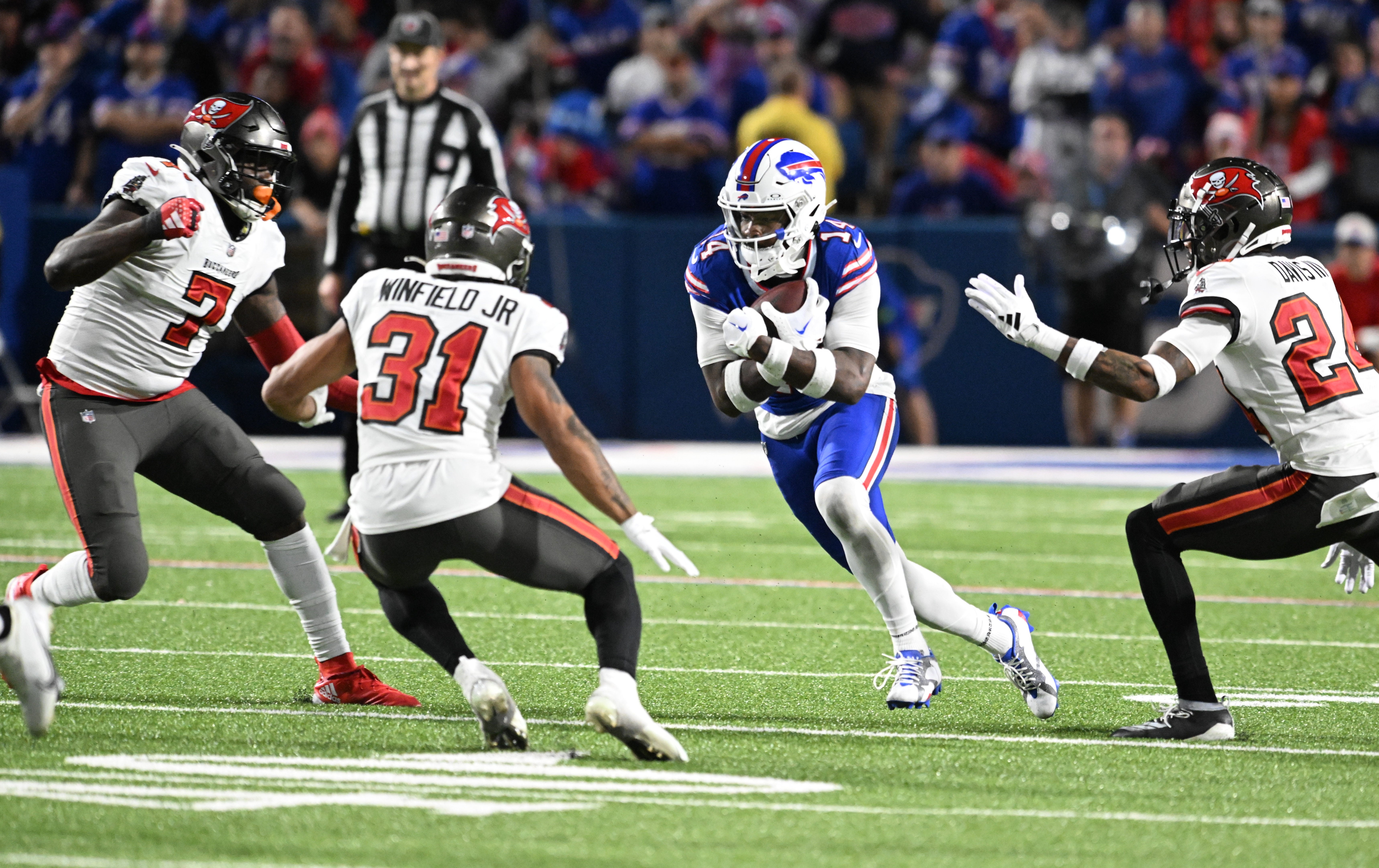 Oct 26, 2023; Orchard Park, New York, USA; Buffalo Bills wide receiver Stefon Diggs (14) is surrounded by Tampa Bay Buccaneers safety Antoine Winfield Jr. (31) and linebacker Shaquil Barrett (7) and cornerback Carlton Davis III (24) after making a catch in the fourth quarter at Highmark Stadium. Mandatory Credit: Mark Konezny-USA TODAY Sports
