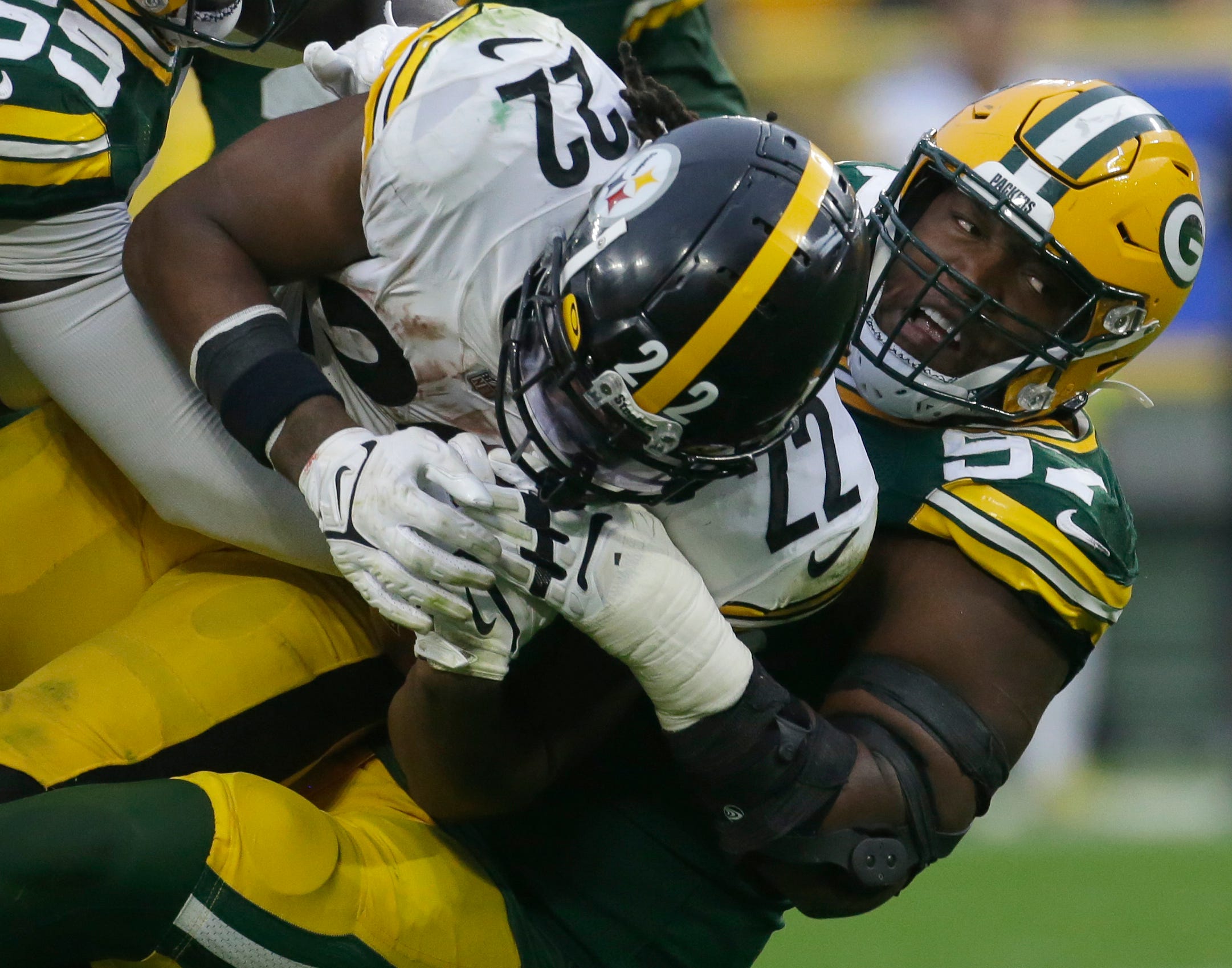 Green Bay Packers nose tackle Kenny Clark (97) stuffs Pittsburgh Steelers running back Najee Harris (22)- at the line during the third quarter of their game Sunday, October 3, 2021 at Lambeau Field in Green Bay, Wis. Green Bay Packers beat the Pittsburgh Steelers 27-17. Mjs Packers04 16 Jpg Packers04  