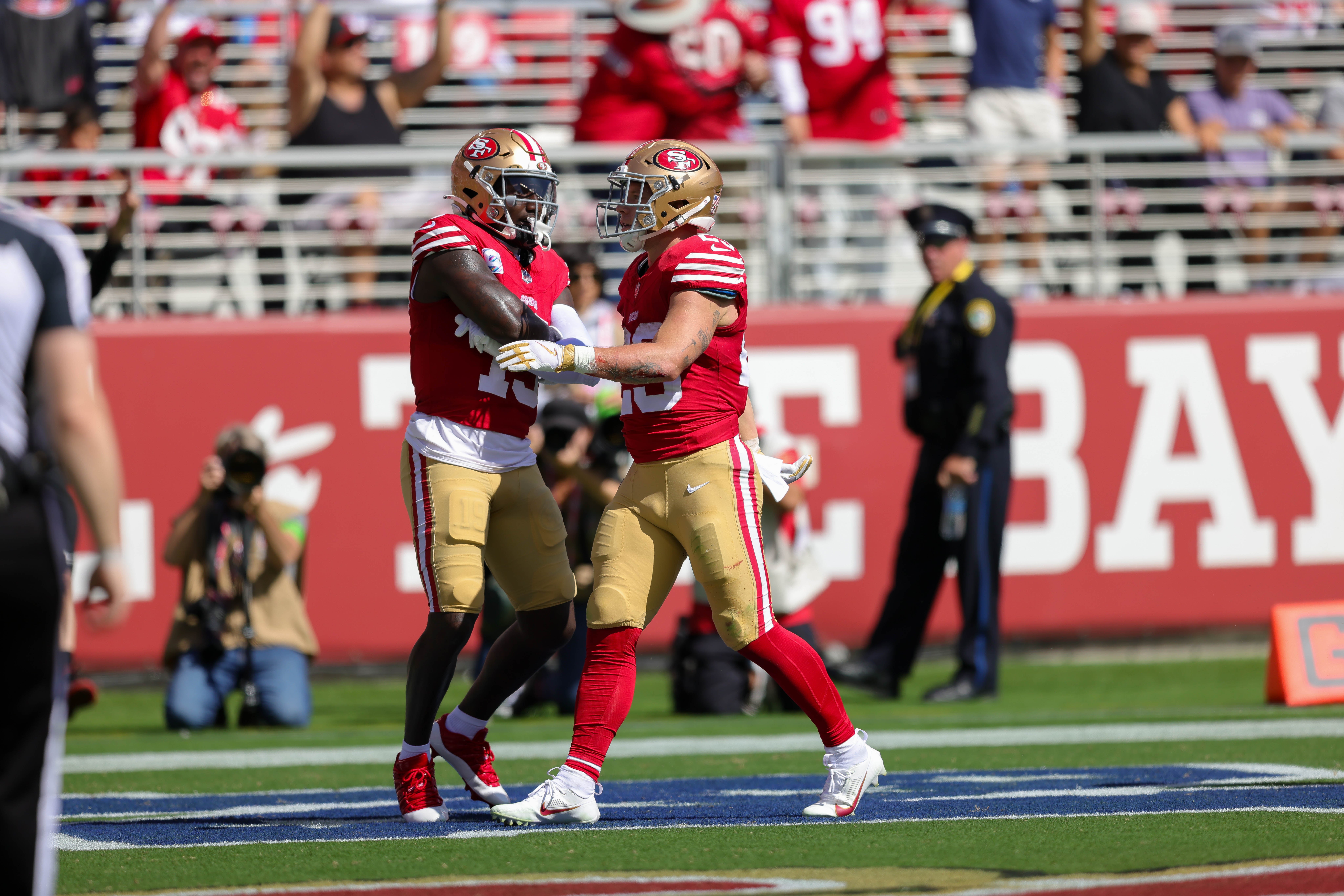 Oct 1, 2023; Santa Clara, California, USA; San Francisco 49ers running back Christian McCaffrey (23) celebrates with wide receiver Deebo Samuel (19) after a scoring a touchdown during the second quarter against the Arizona Cardinals at Levi's Stadium.