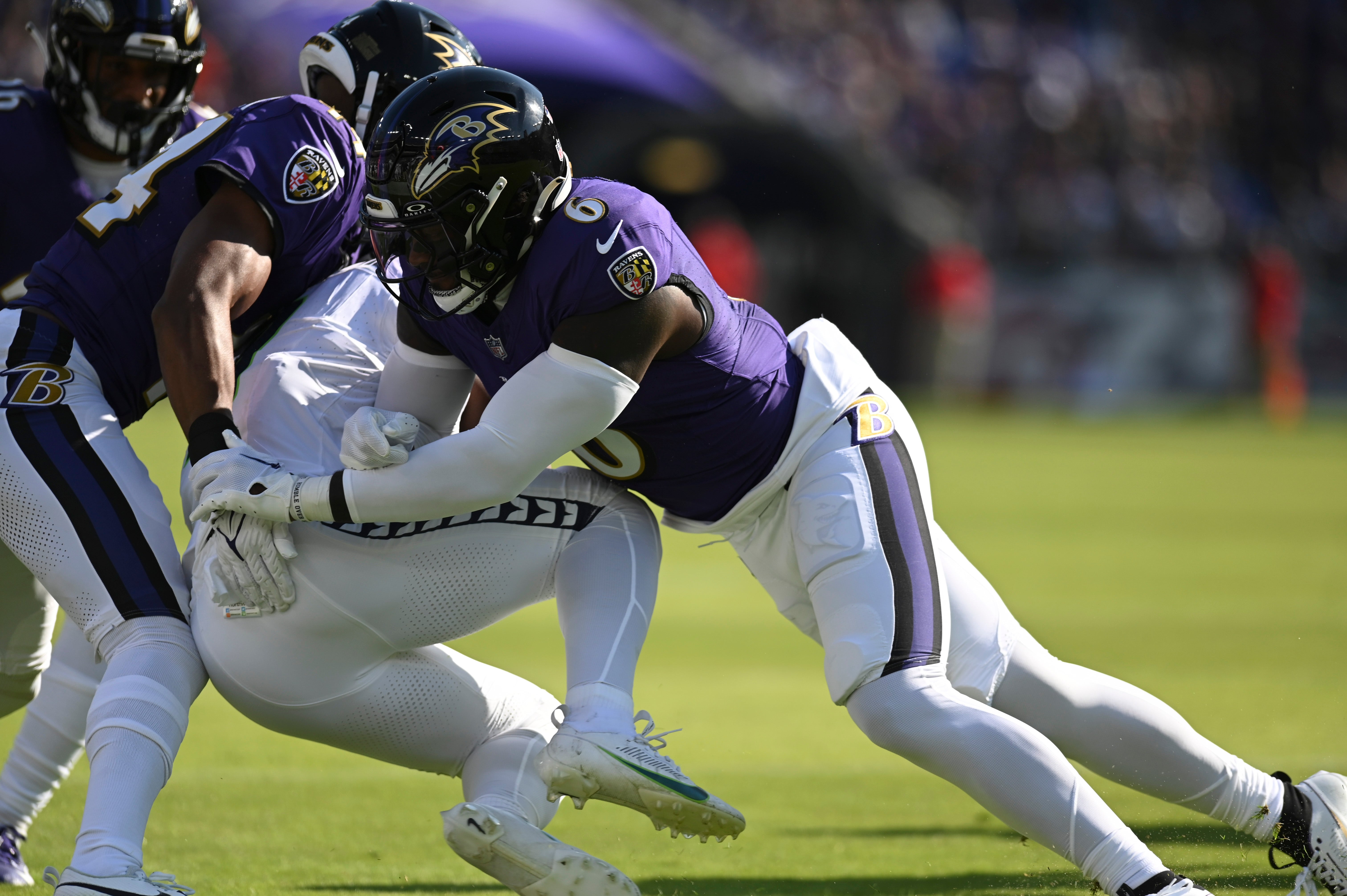 Baltimore Ravens linebacker Patrick Queen (6) tackles Seattle Seahawks running back Kenneth Walker III (9) during the first half at M&T Bank Stadium. Mandatory Credit: Tommy Gilligan-USA TODAY Sports