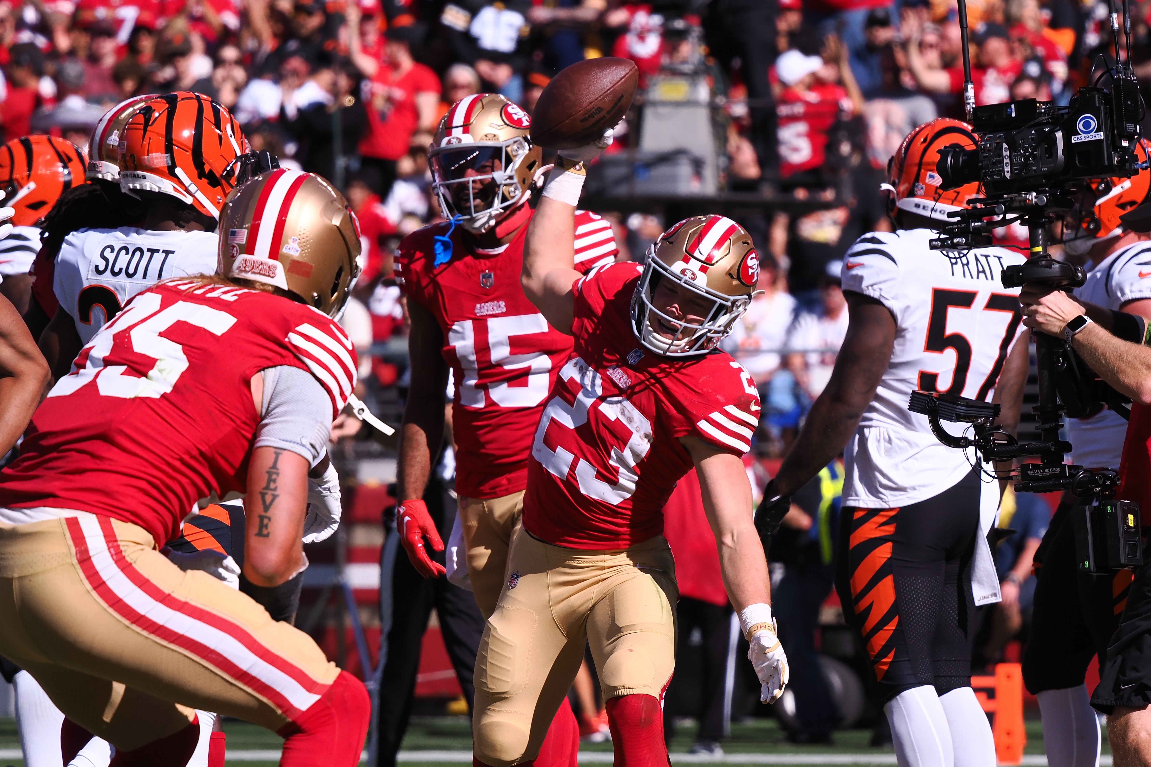 Oct 29, 2023; Santa Clara, California, USA; San Francisco 49ers running back Christian McCaffrey (23) pretends to spike the ball with tight end George Kittle (85) after scoring a touchdown against the Cincinnati Bengals during the first quarter at Levi's Stadium.