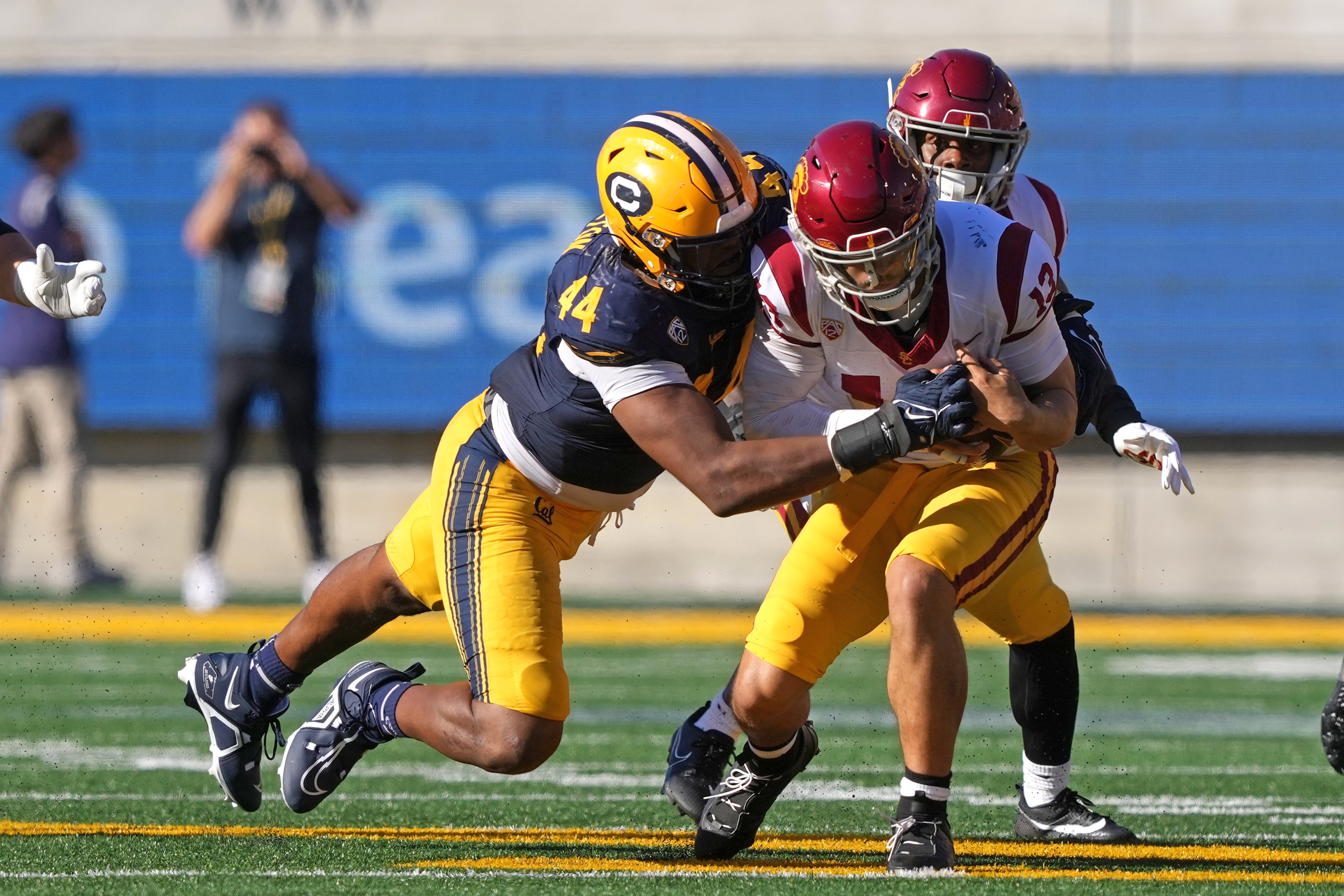 Oct 28, 2023; Berkeley, California, USA; California Golden Bears linebacker Xavier Carlton (44) sacks USC Trojans quarterback Caleb Williams (13) during the third quarter at California Memorial Stadium.