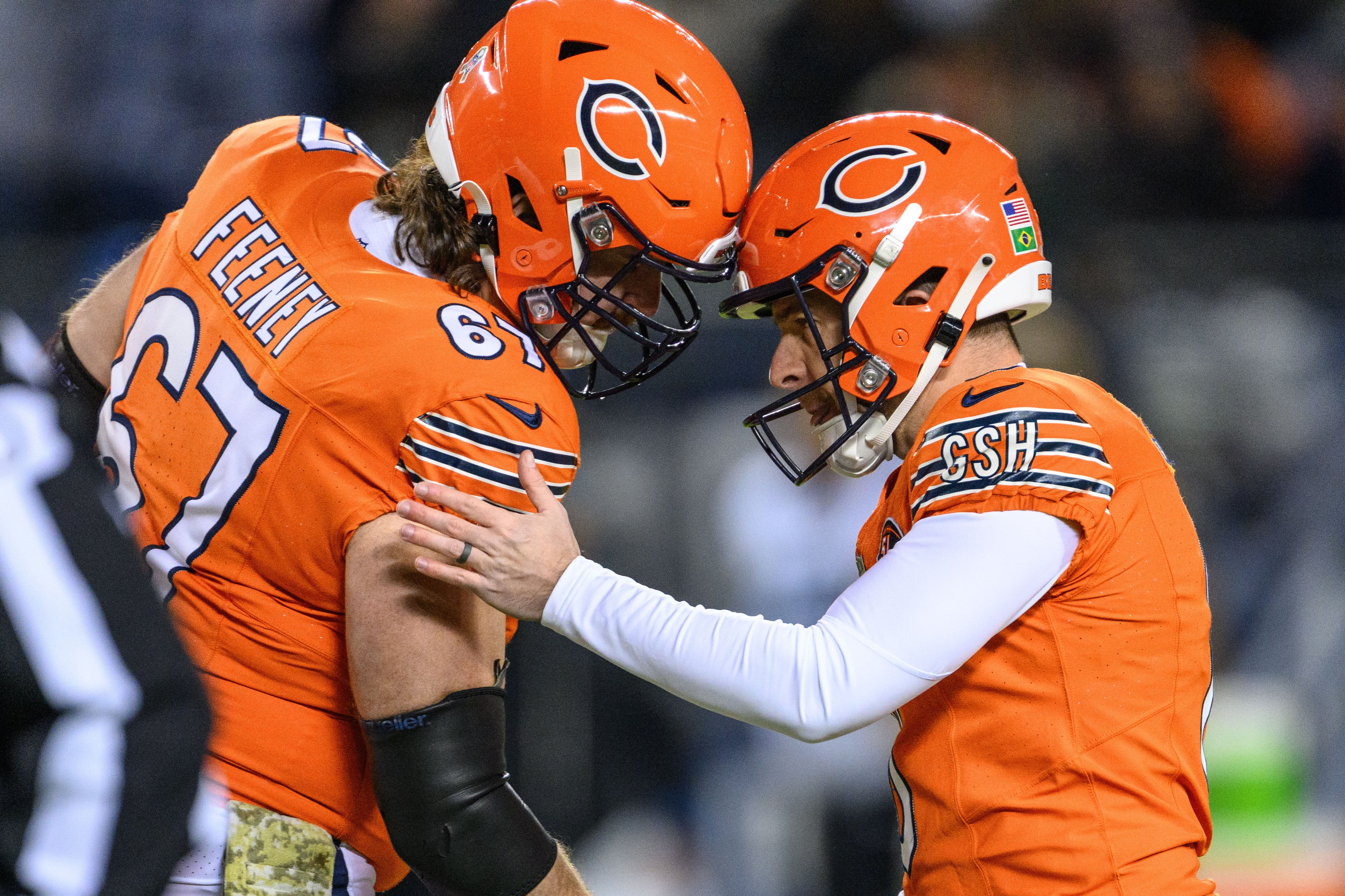 Nov 9, 2023; Chicago, Illinois, USA; Chicago Bears offensive lineman Dan Feeney (67) and kicker Cairo Santos (8) celebrates a Santos field goal against the Carolina Panthers during the first quarter at Soldier Field.