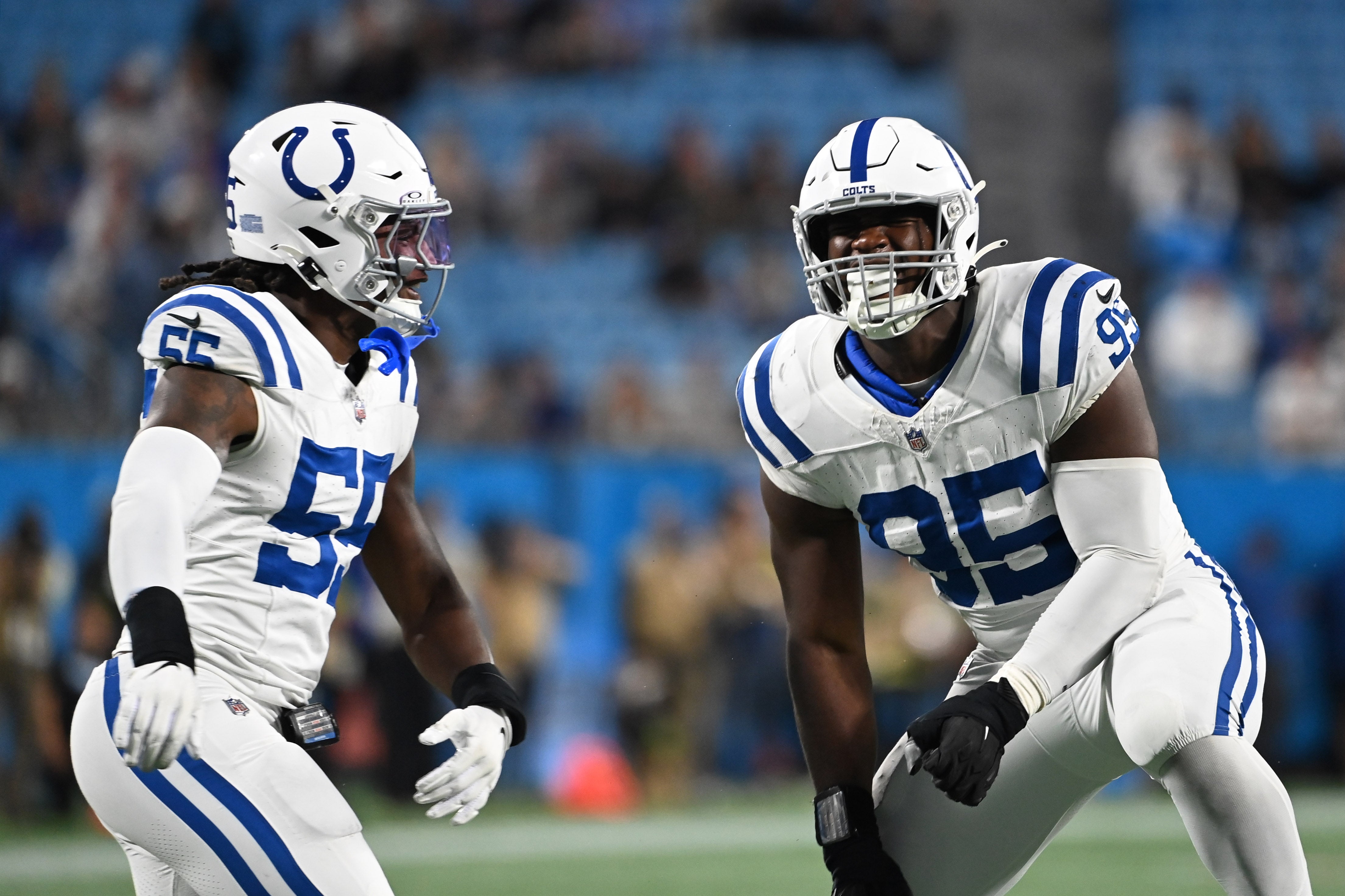 Nov 5, 2023; Charlotte, North Carolina, USA; Indianapolis Colts defensive end Adetomiwa Adebawore (95) reacts with linebacker Isaiah Land (55) after a sack in the fourth quarter at Bank of America Stadium.