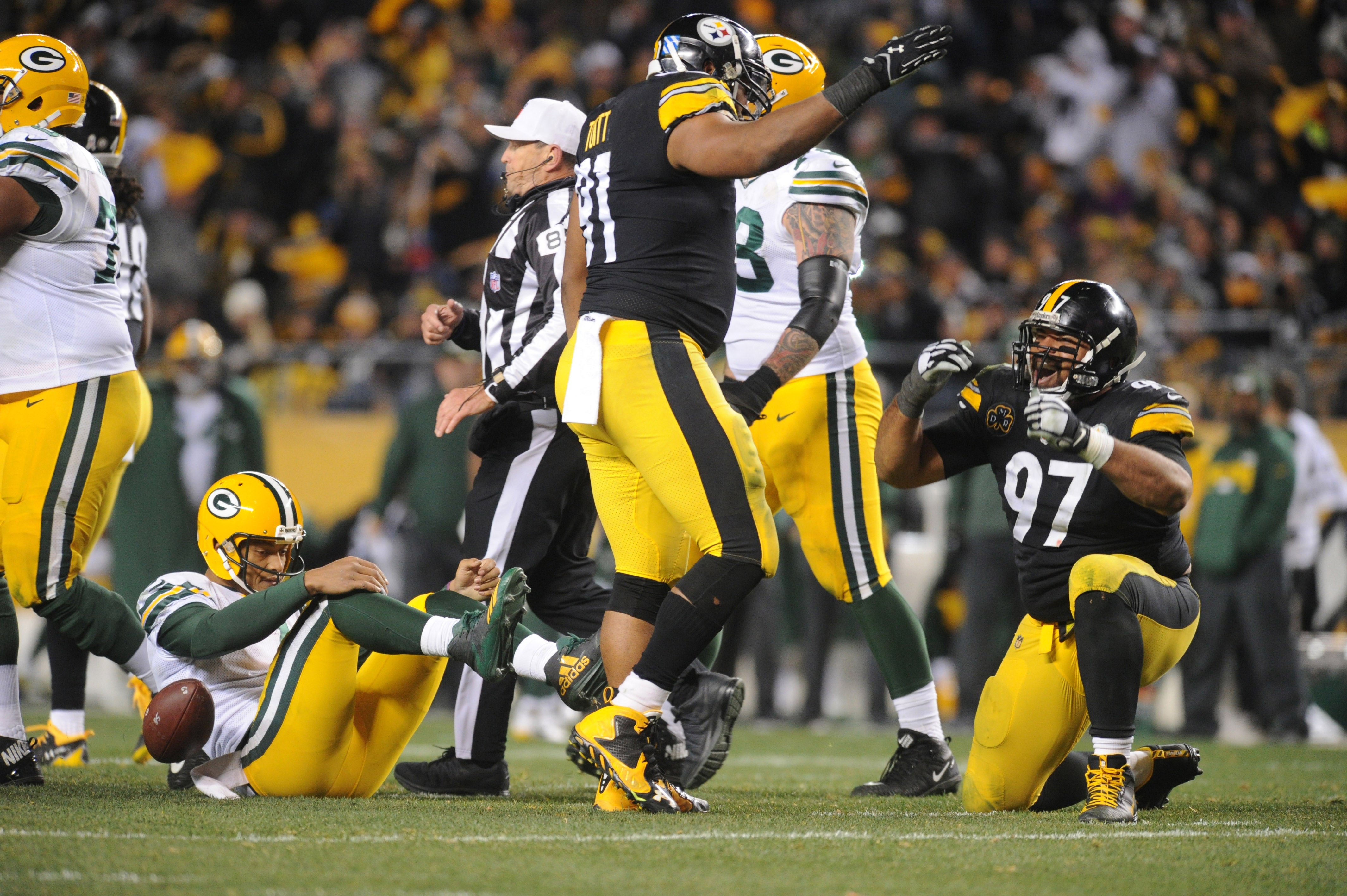 Nov 26, 2017; Pittsburgh, PA, USA;Pittsburgh Steelers defensive end Cameron Heyward (97) and defensive end Stephon Tuitt (91) celebrate after a sack against Green Bay Packers quarterback Brett Hundley (7) in the third quarter at Heinz Field. The Steelers won 31-28. Mandatory Credit: Philip G. Pavely-USA TODAY Sports