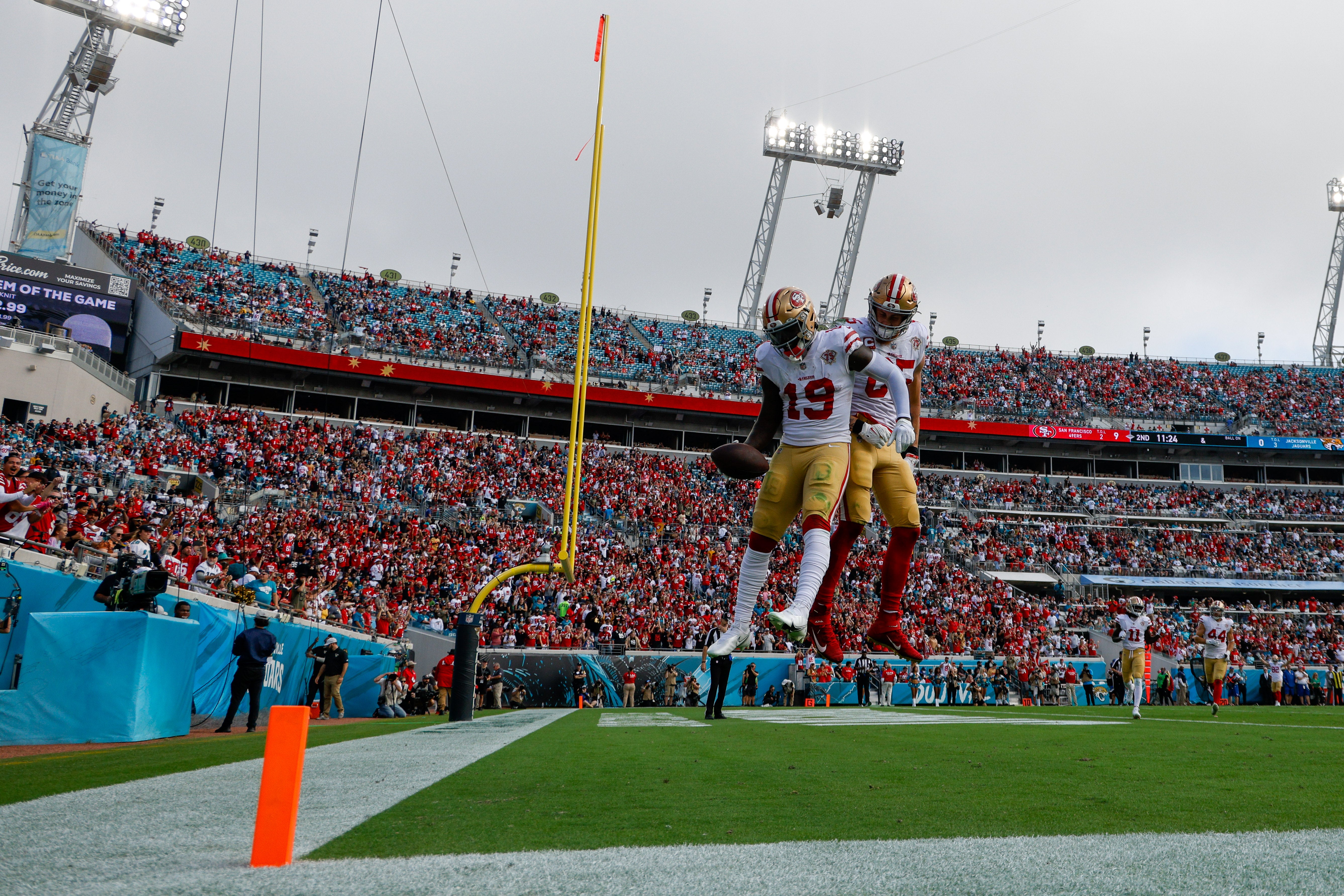 Nov 21, 2021; Jacksonville, Florida, USA; San Francisco 49ers wide receiver Deebo Samuel (19) celebrates with tight end George Kittle (85) after scoring a touchdown in the first half against the Jacksonville Jaguars at TIAA Bank Field.