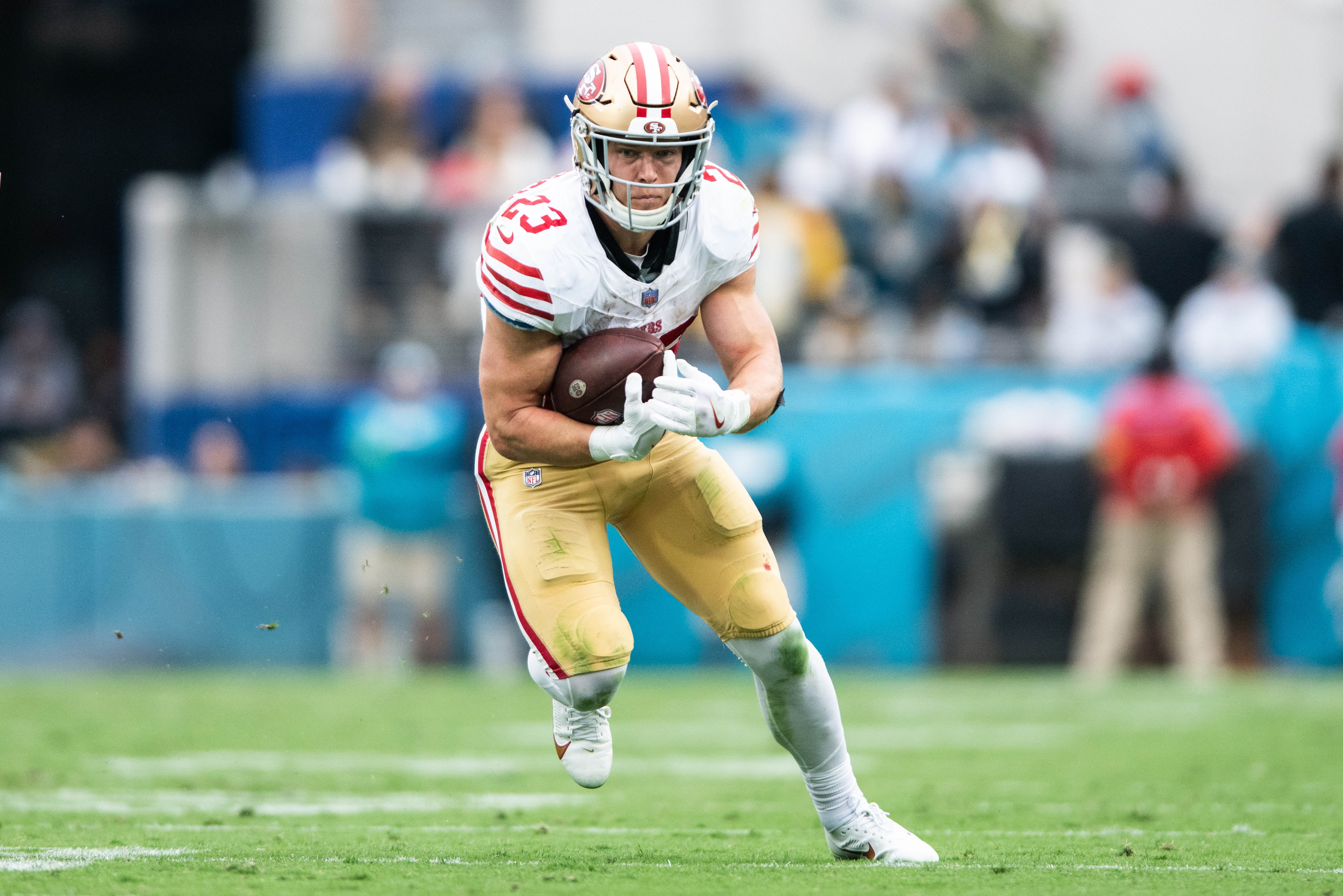 Nov 12, 2023; Jacksonville, Florida, USA; San Fransisco 49ers running back Christian McCaffrey (23) runs the ball after the catch against the Jacksonville Jaguars in the second quarter at EverBank Stadium.