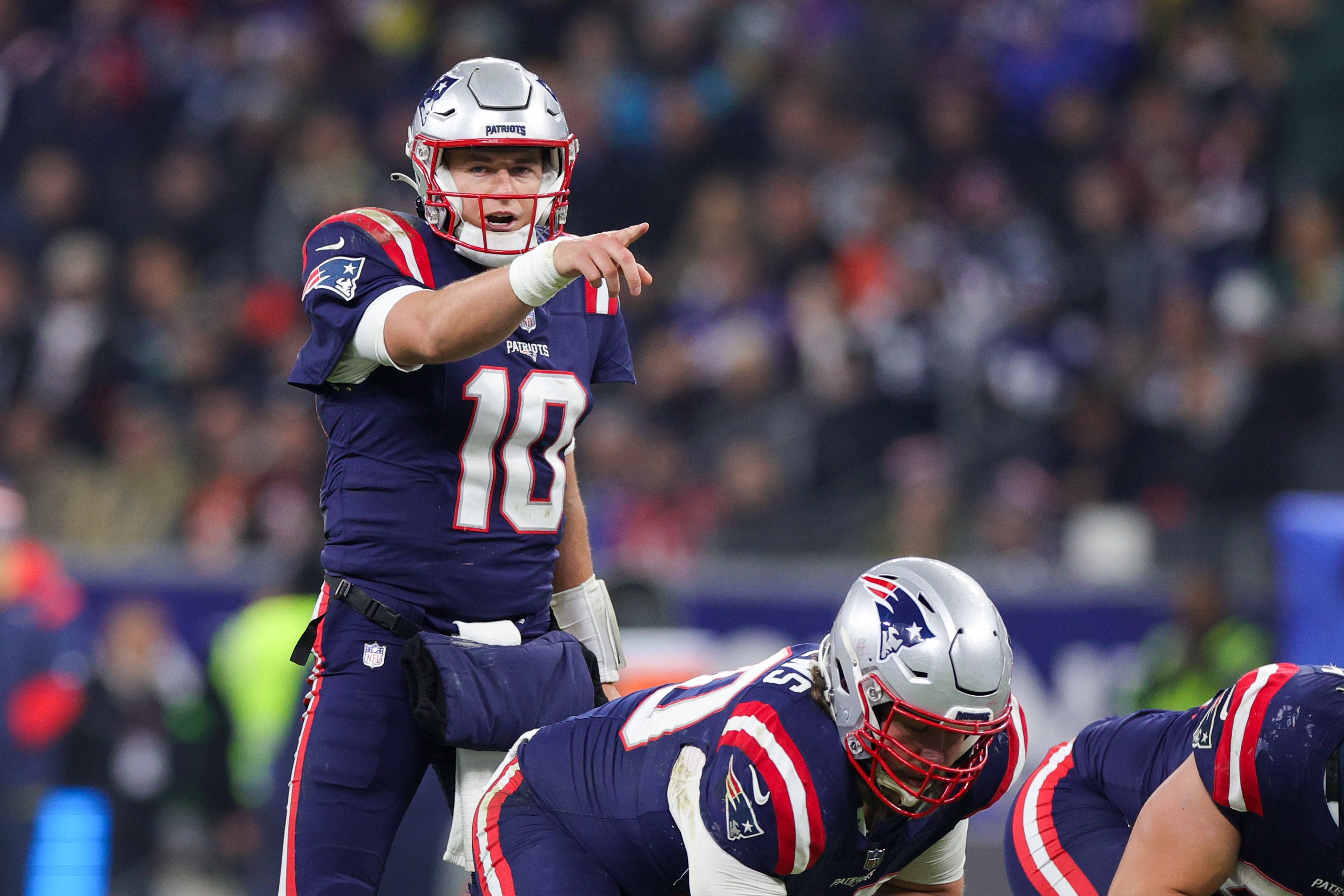 New England Patriots quarterback Mac Jones calls a play at the line against the Indianapolis Colts in the fourth quarter