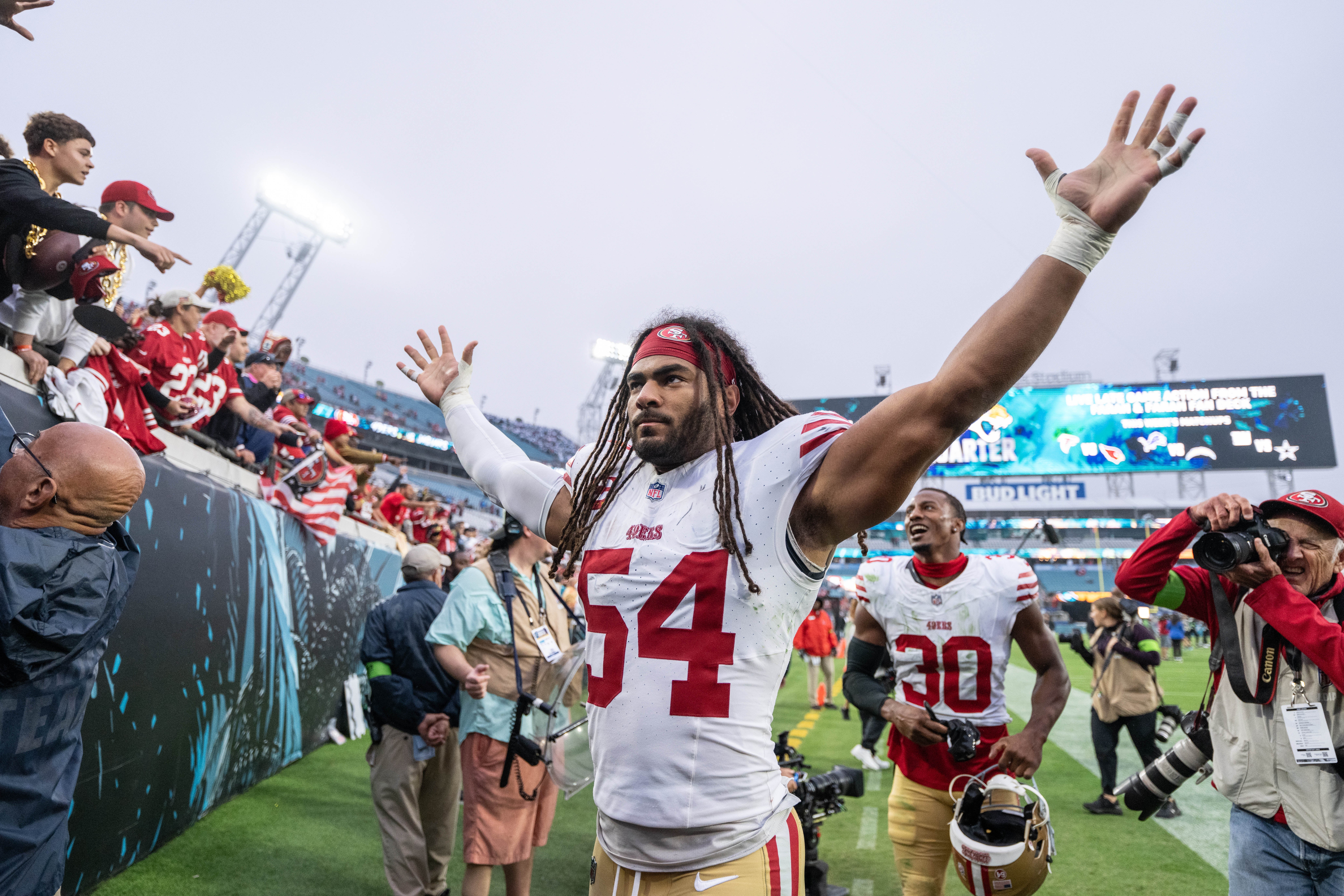 Nov 12, 2023; Jacksonville, Florida, USA; San Fransisco 49ers linebacker Fred Warner (54) celebrates the win over the Jacksonville Jaguars after the game at EverBank Stadium.