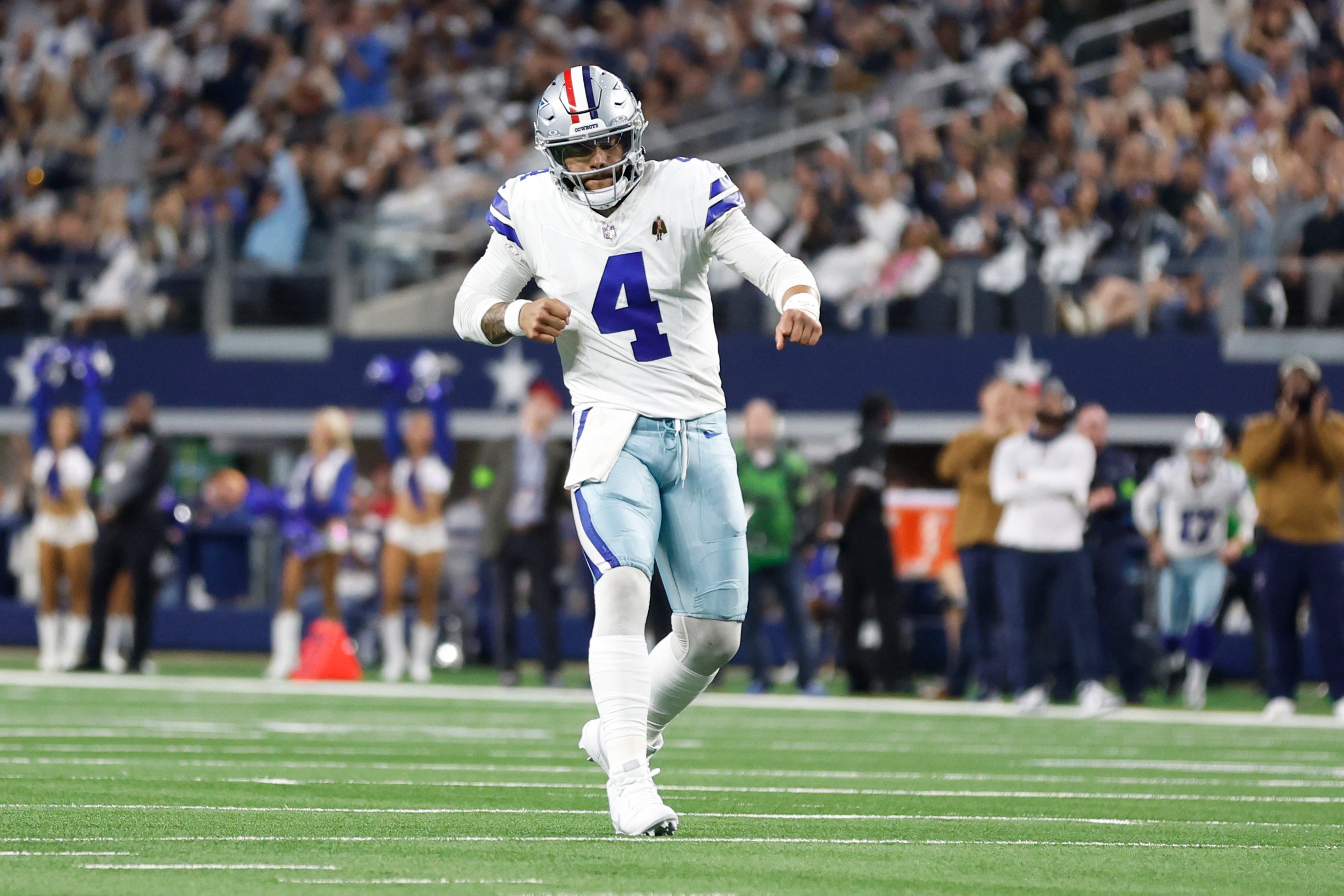Dallas Cowboys quarterback Dak Prescott (4) reacts after throwing a touchdown pass in the second quarter against the New York Giants at AT&T Stadium.