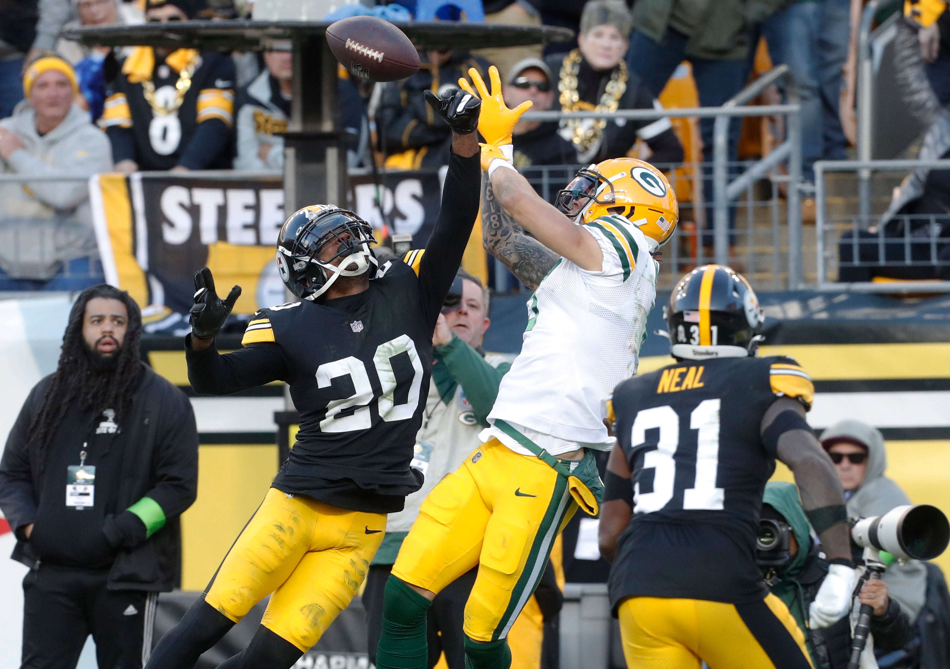 Nov 12, 2023; Pittsburgh, Pennsylvania, USA; Pittsburgh Steelers cornerback Patrick Peterson (20) and safety Keanu Neal (31) defend a pass intended for Green Bay Packers wide receiver Christian Watson (middle) in the end-zone during the fourth quarter at Acrisure Stadium. Pittsburgh won 23-19. Mandatory Credit: Charles LeClaire-USA TODAY Sports  