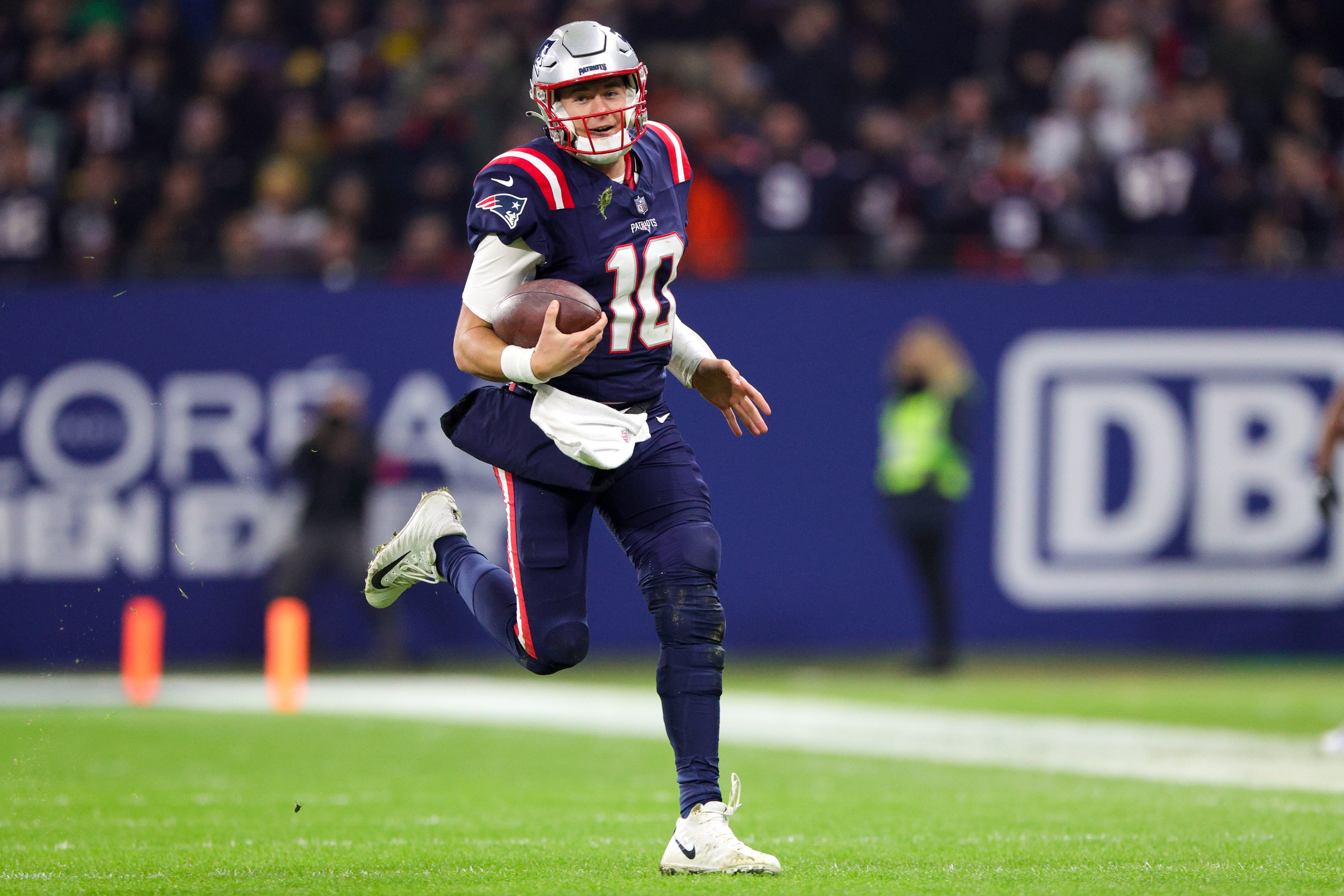 New England Patriots quarterback Mac Jones runs with the ball against the Indianapolis Colts in the third quarter during an International Series game at Deutsche Bank Park