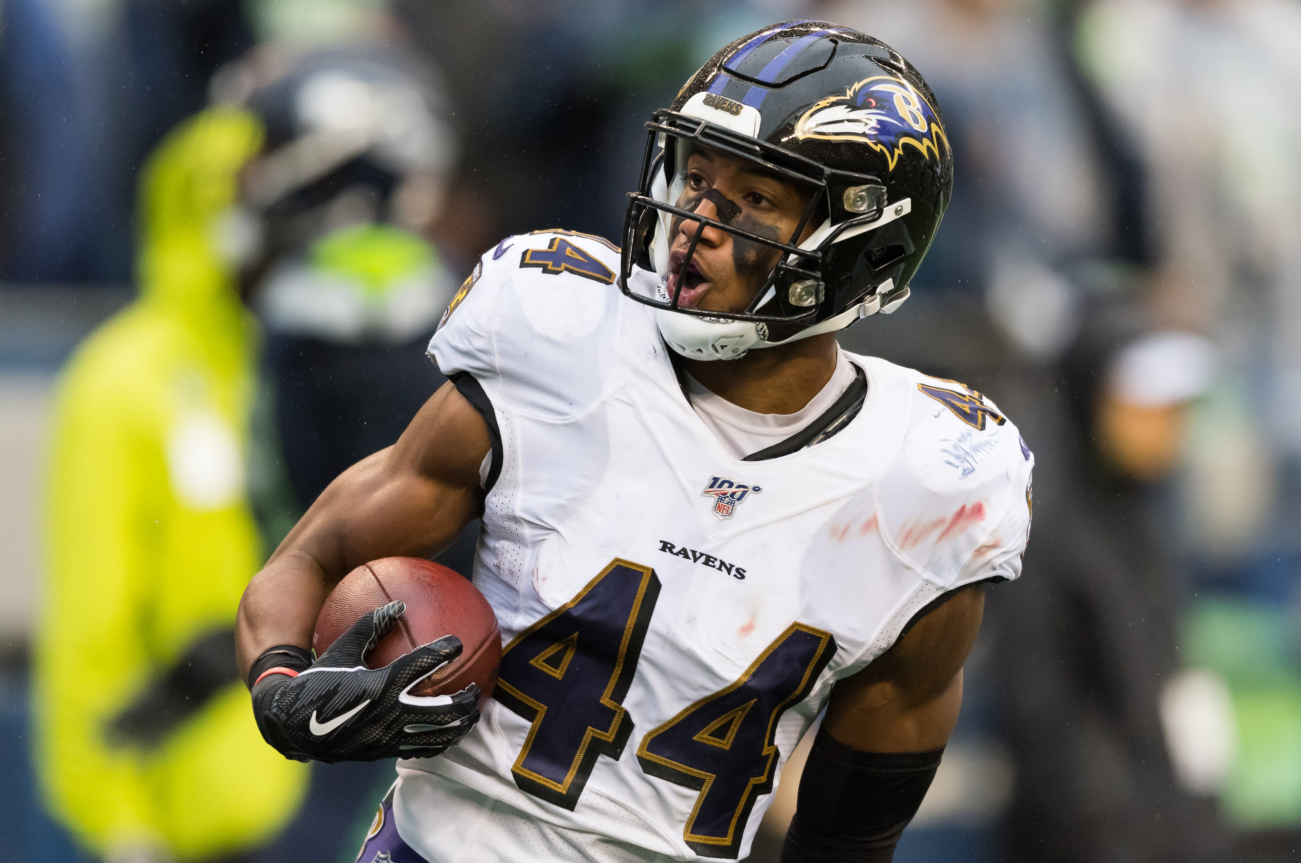 Baltimore Ravens cornerback Marlon Humphrey (44) recovers a fumble and runs it back for a touchdown against the Seattle Seahawks during the second half at CenturyLink Field. Baltimore defeated Seattle 30-16.