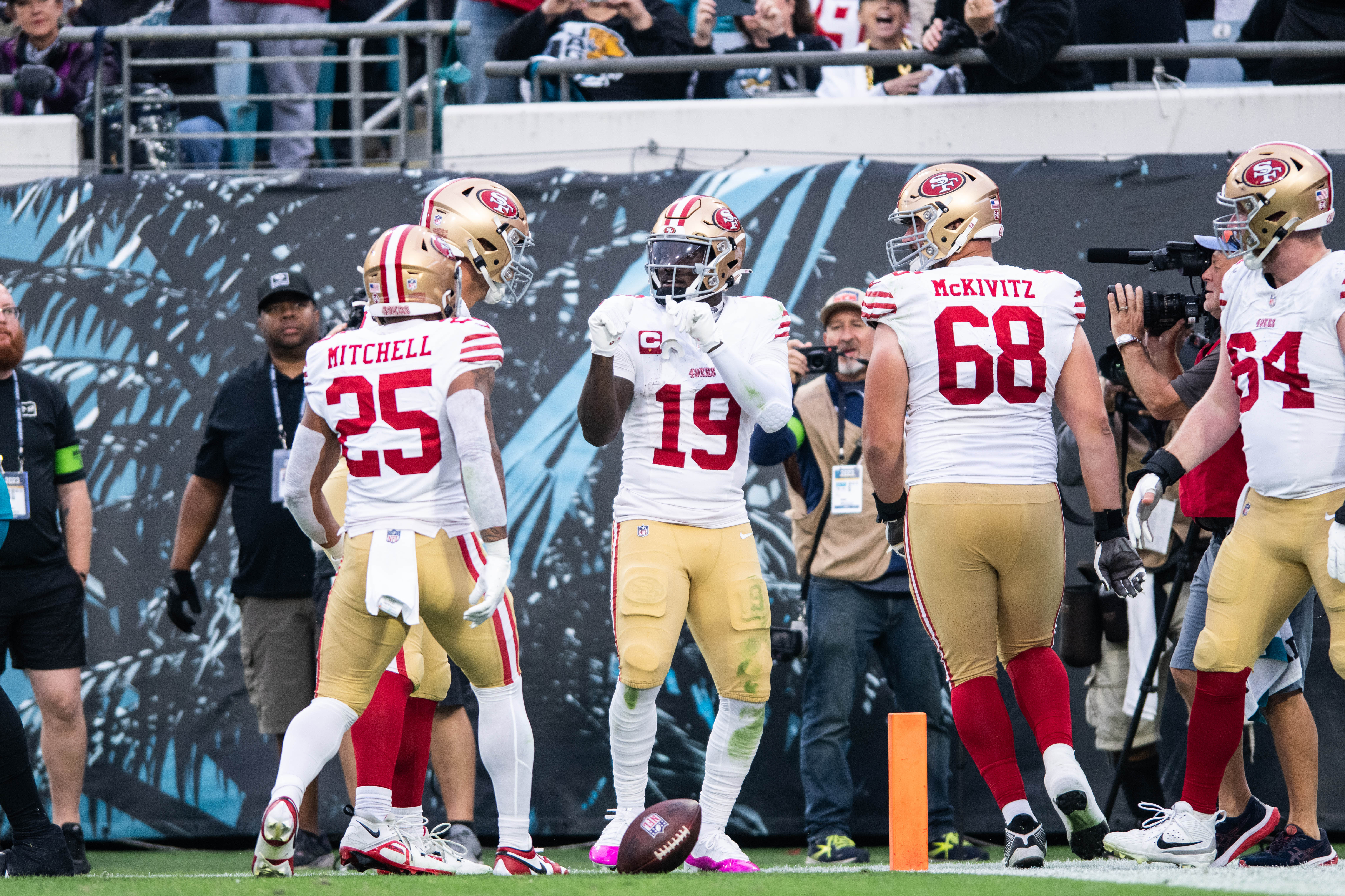 Nov 12, 2023; Jacksonville, Florida, USA; San Fransisco 49ers wide receiver Deebo Samuel (19) celebrates a touchdown with Elijah Mitchell (25),offensive lineman Colton McKivitz (68) and offensive lineman Jake Brendel (64) against the Jacksonville Jaguars in the third quarter at EverBank Stadium.