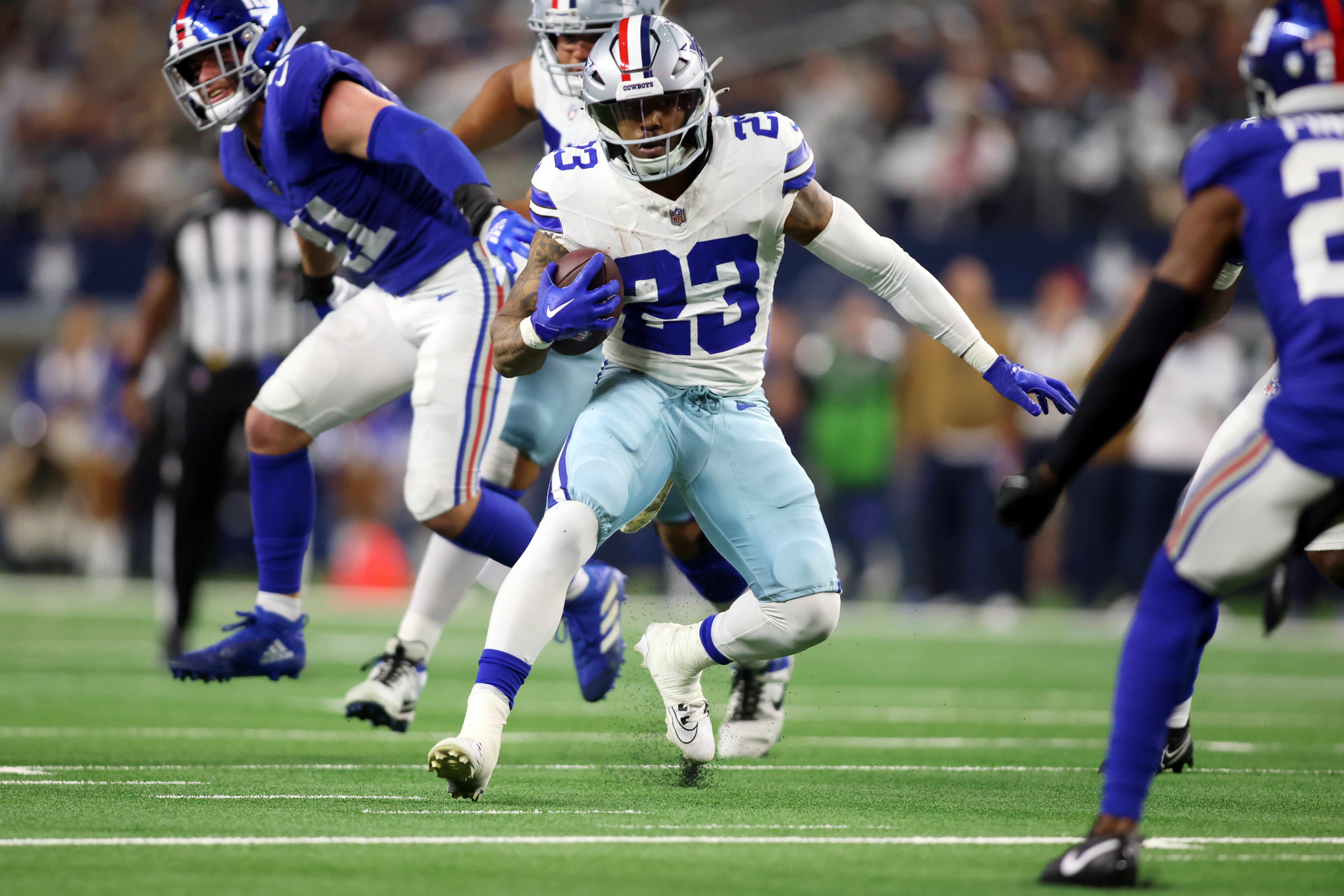Dallas Cowboys running back Rico Dowdle (23) runs the ball against the New York Giants in the second quarter at AT&T Stadium.