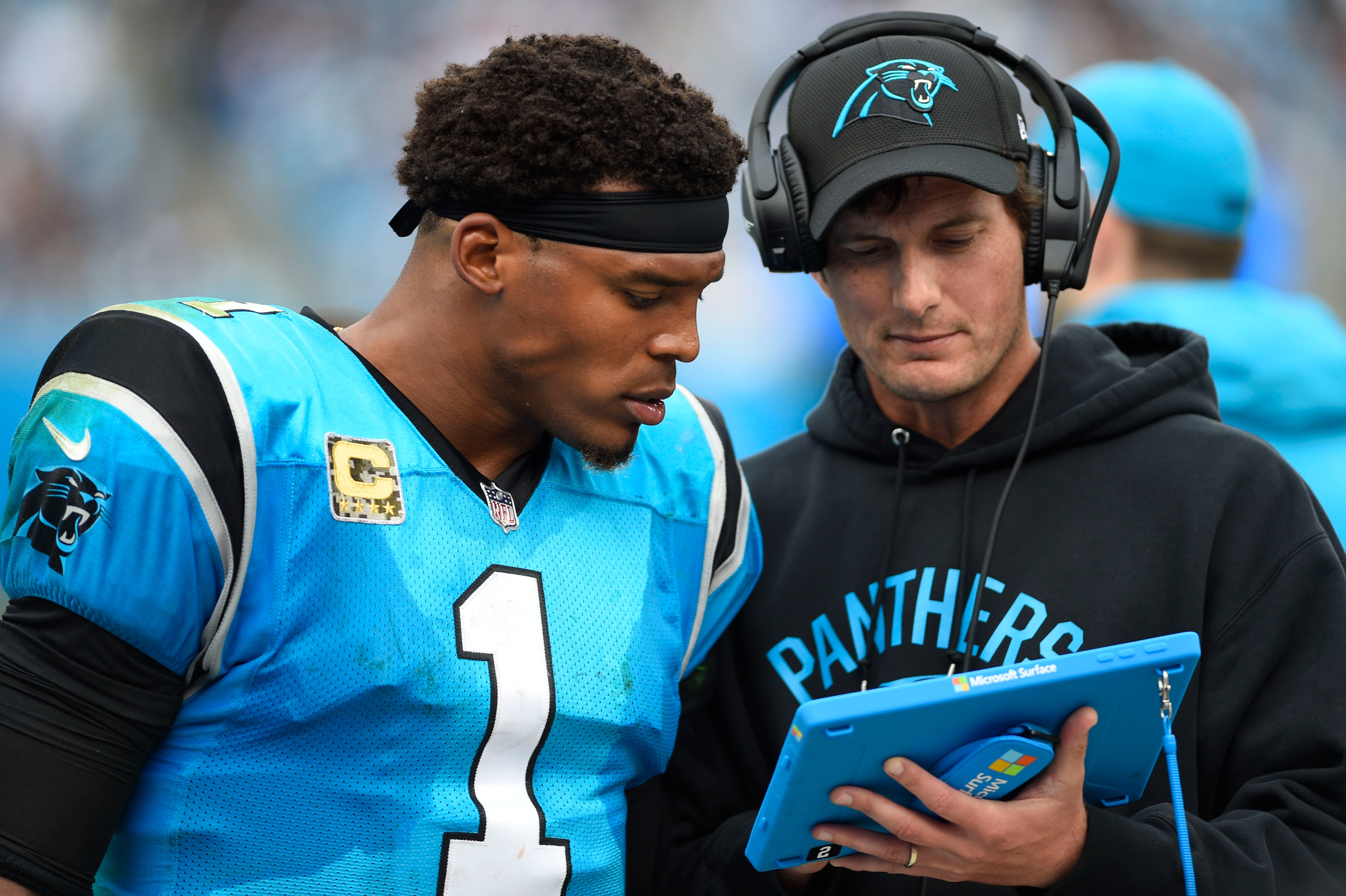 Nov 5, 2017; Charlotte, NC, USA; Carolina Panthers quarterback Cam Newton (1) with quarterbacks coach Ken Dorsey in the third quarter. The Panthers defeated the Falcons 20-17 at Bank of America Stadium. Mandatory Credit: Bob Donnan-USA TODAY Sports
