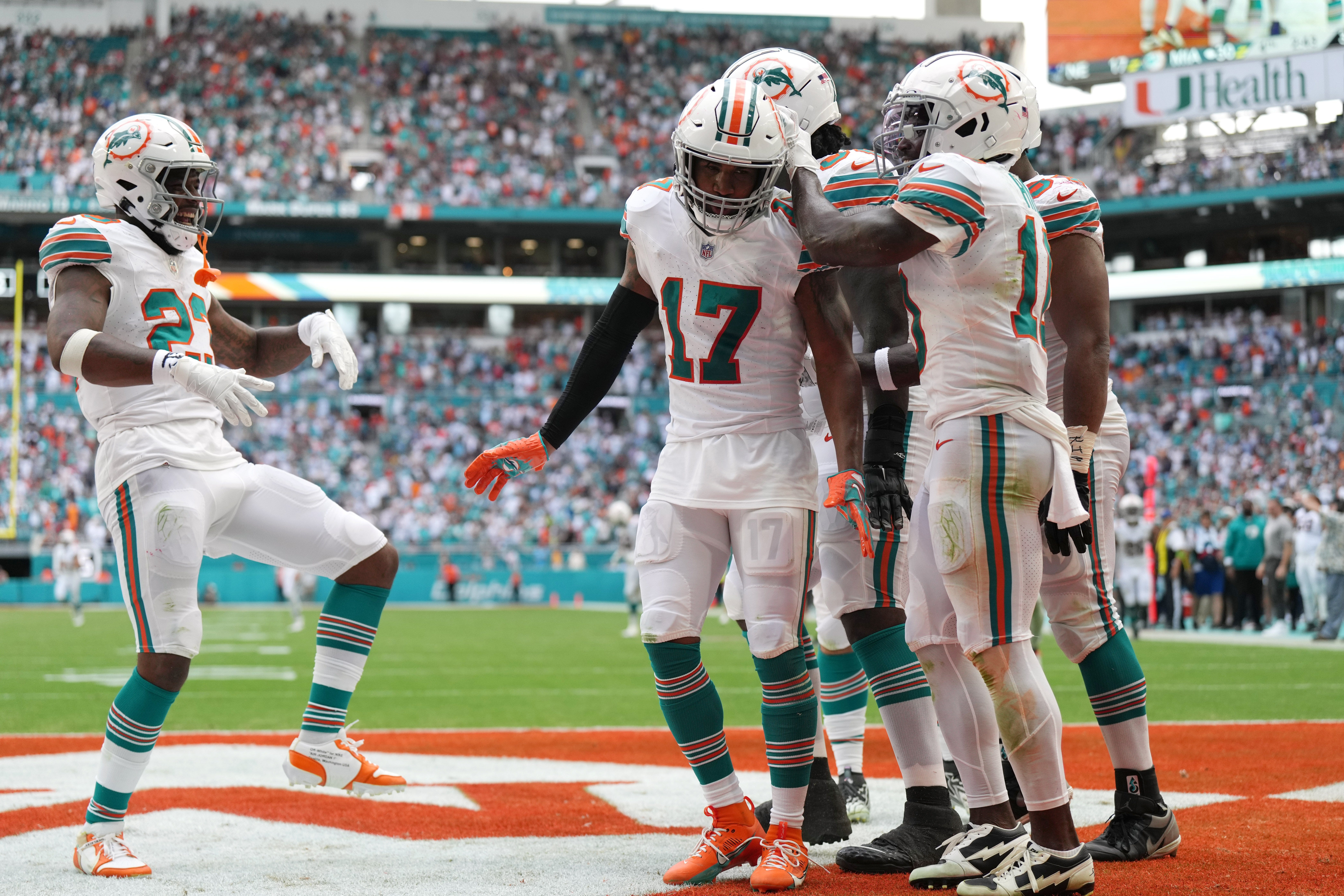 Miami Dolphins wide receiver Jaylen Waddle (17) waddles with teammates after scoring a touchdown against the New England Patriots during the second half of an NFL game at Hard Rock Stadium in Miami Gardens, Oct. 29, 2023.
