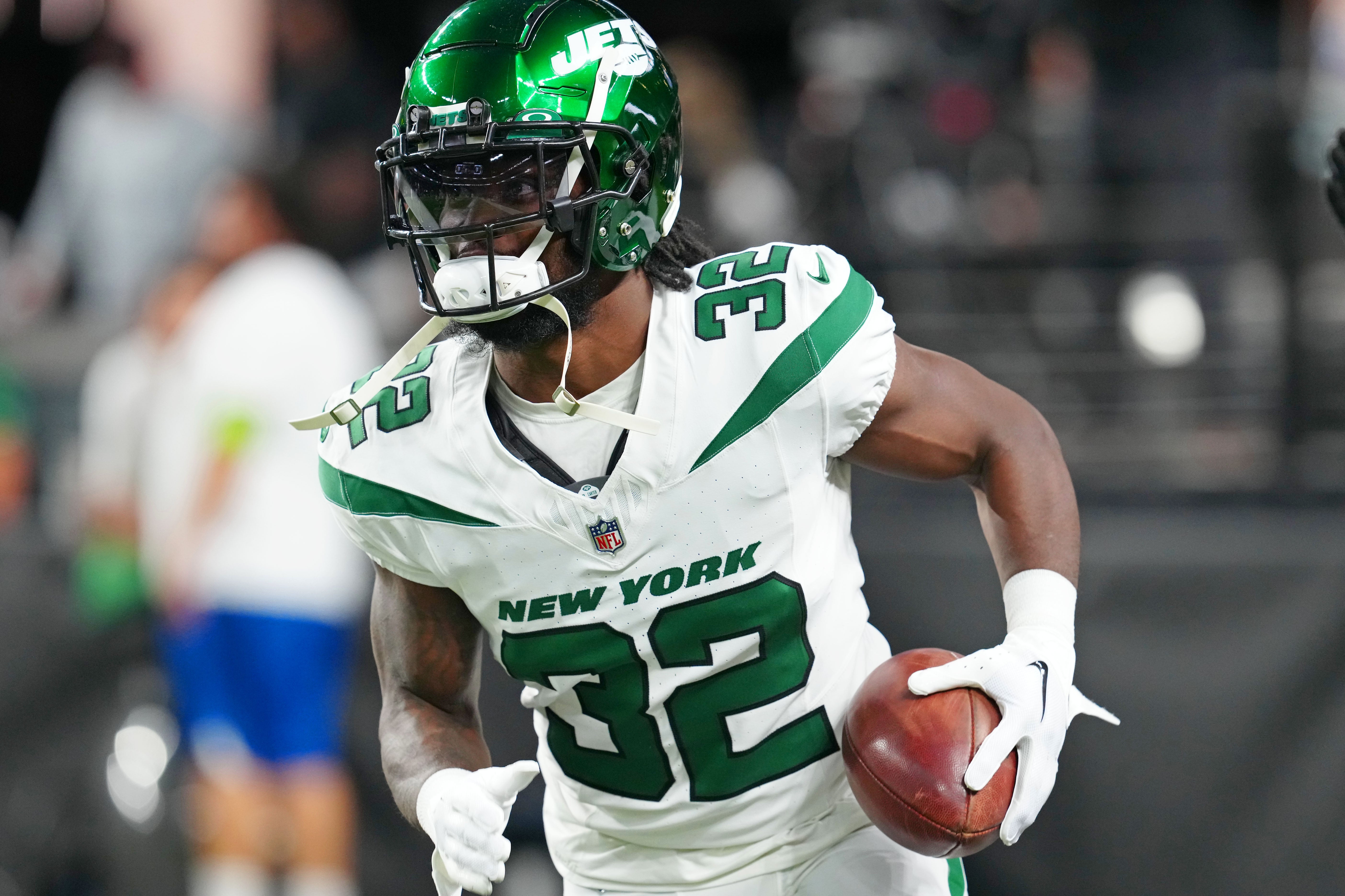New York Jets running back Michael Carter (32) warms up before the start of a game against the Las Vegas Raiders at Allegiant Stadium.