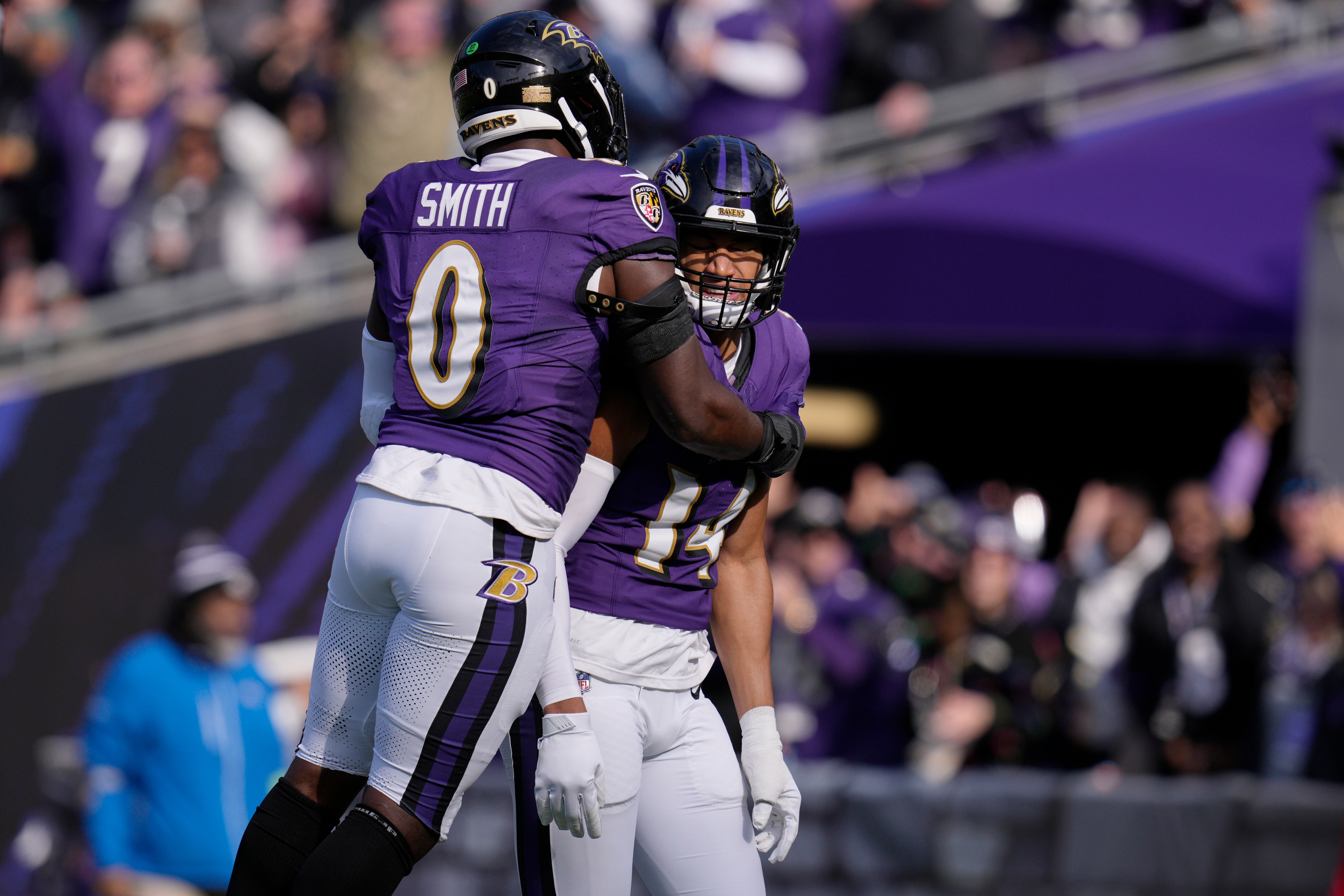 Baltimore Ravens safety Kyle Hamilton (14) celebrates with linebacker Roquan Smith (0) after scoring a touchdown against the Cleveland Browns during the first quarter at M&T Bank Stadium.