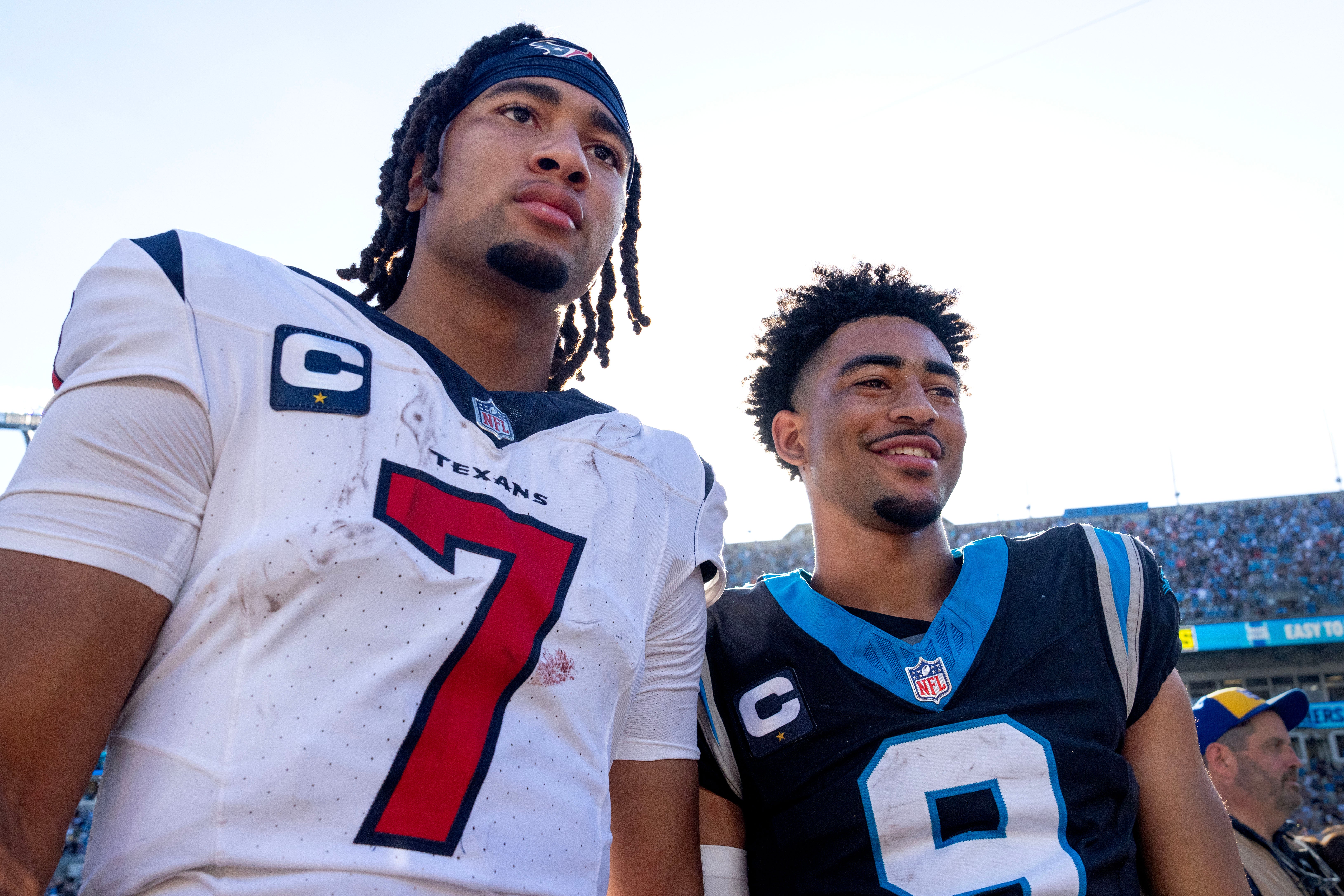 Oct 29, 2023; Charlotte, North Carolina, USA; Houston Texans quarterback C.J. Stroud (7) and Carolina Panthers quarterback Bryce Young (9) after the game at Bank of America Stadium. Mandatory Credit: Bob Donnan-USA TODAY Sports
