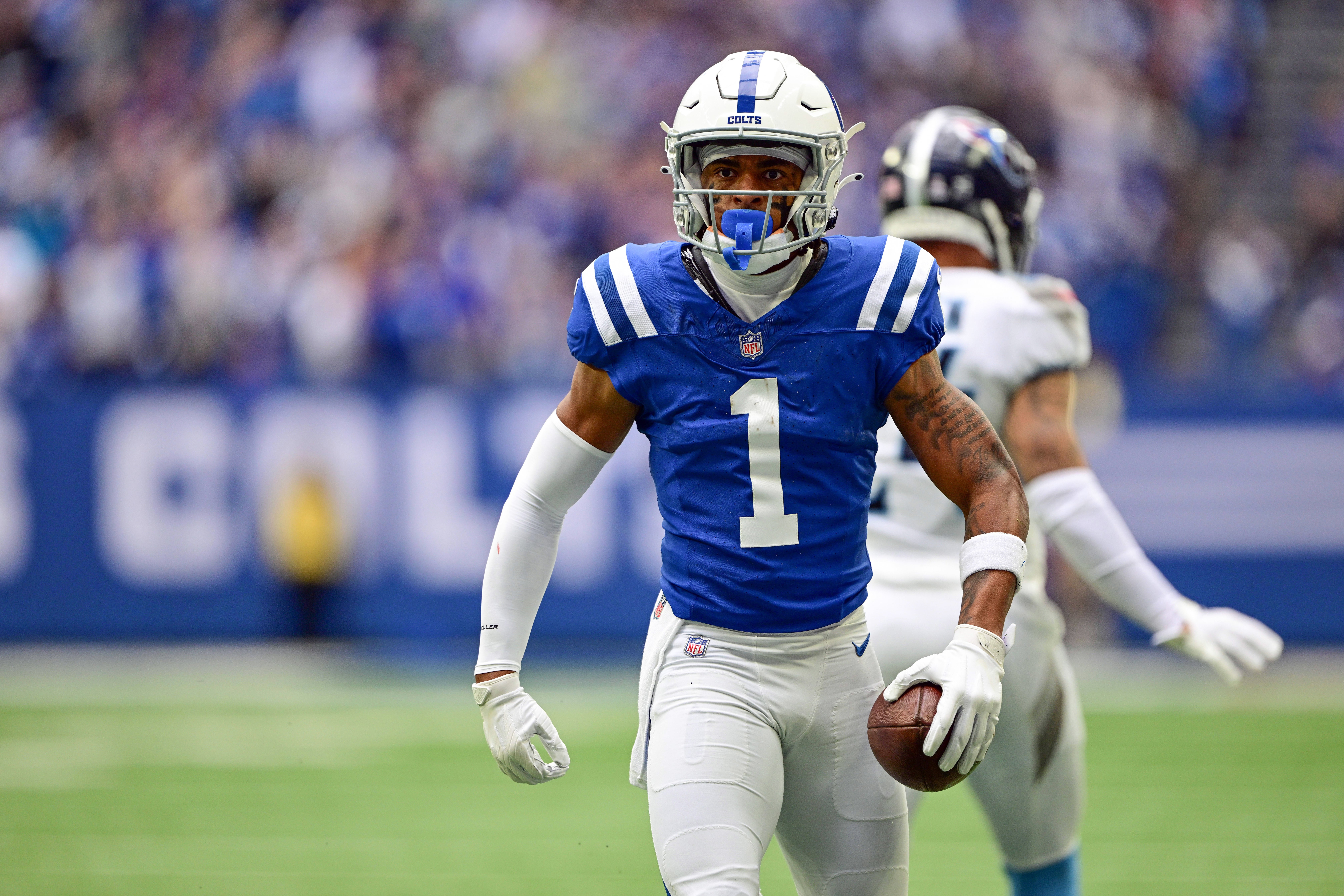 Oct 8, 2023; Indianapolis, Indiana, USA; Indianapolis Colts wide receiver Josh Downs (1) reacts after catching a long pass during the second quarter against the Tennessee Titans at Lucas Oil Stadium.