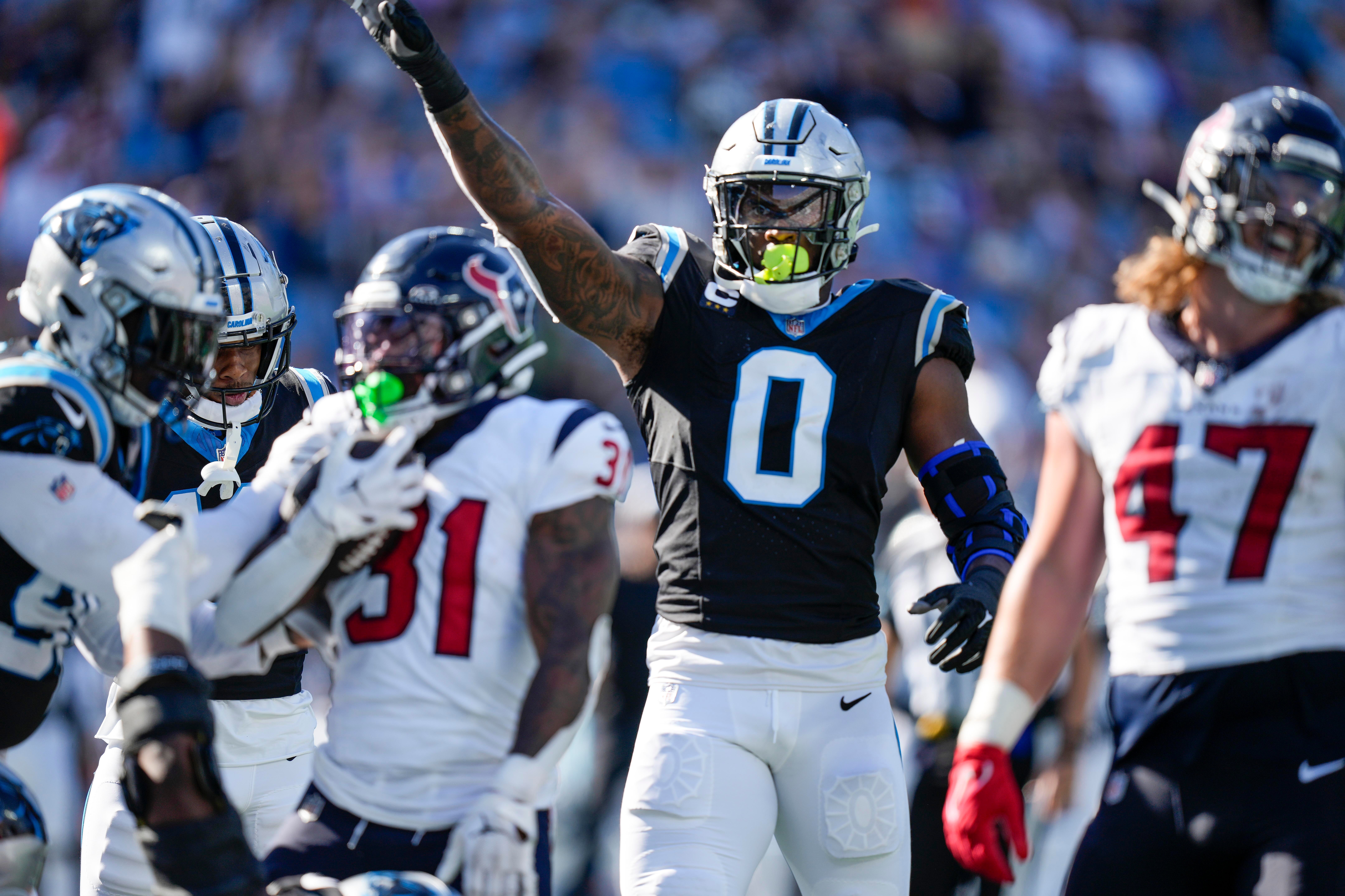 Oct 29, 2023; Charlotte, North Carolina, USA; Carolina Panthers linebacker Brian Burns (0) celebrates the goal line stop against the Houston Texans during the second half at Bank of America Stadium. Mandatory Credit: Jim Dedmon-USA TODAY Sports